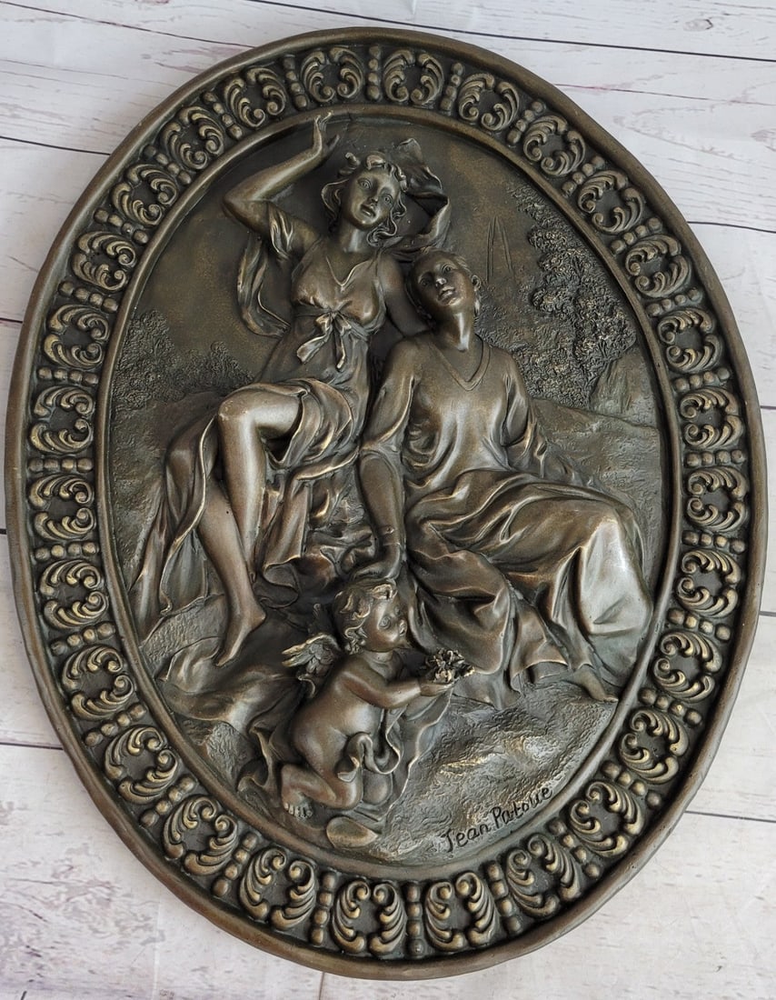 Italian Renaissance Relief Bronze Sculpture: In the Italian Renaissance, this high-relief wall sculpture boasts mother and child ringed by angelic cherubs. Our quality designer pure bronze exclusive original captures each detail of this beautifu