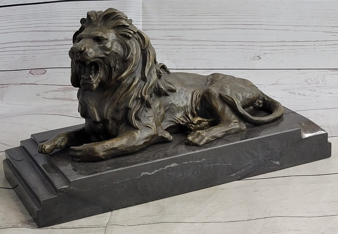 African Lion Roaring Bronze Sculpture: He is angry, hungry, and unrelenting. The lion's paws grip the ground, the tension spreads like a current from his paws to all the tendons in his body. His mouth is open wide in what can only be a