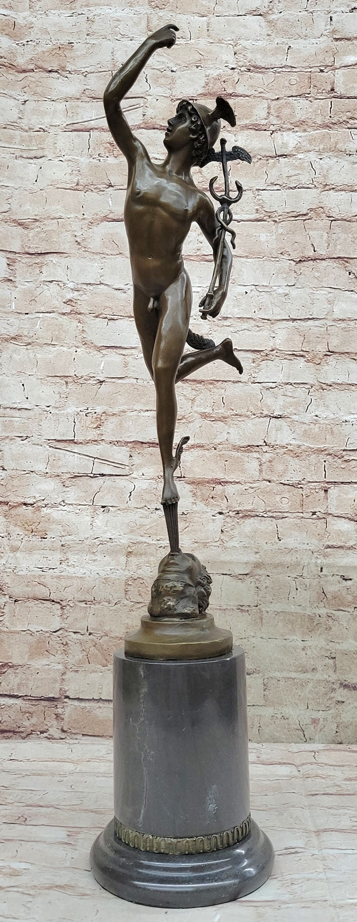 Roman Mercury Figure Ancient Bronze Sculpture: He is depicted wearing a winged Pegasus on his head and winged sandals which give him speed in flight. He carries the caduceus in his hand, the staff was given to him by Apollo that has come to symbol