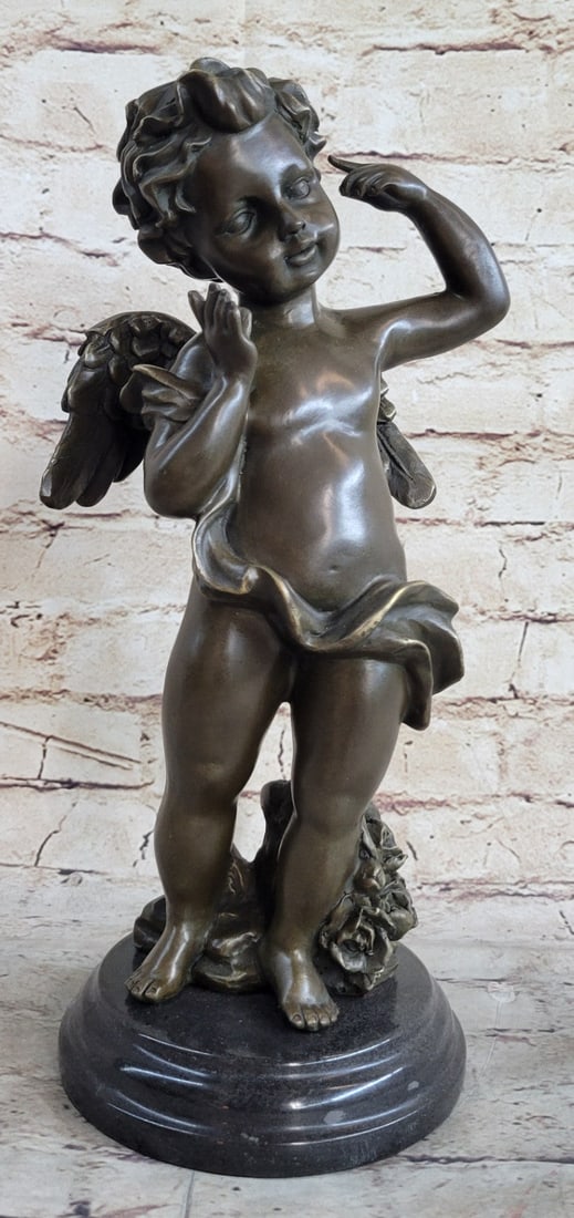 Bouncy Happy Cherub Angel Bronze Sculpture: The bouncy cherub points and waves his hands quizzically near his face. His hair is beautiful curls on top of his round childish face. A cloth sashes from the top of his arm down the side of his body 
