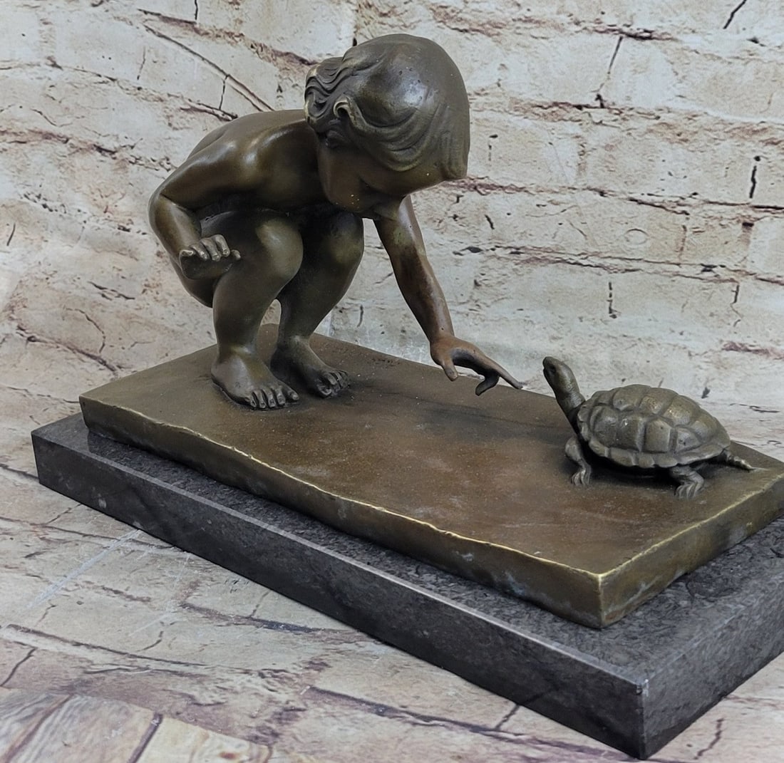 Little Girl Playing With Turtle Bronze Sculpture: Here is a sweet-styled Art Deco bronze on a marble base. It displays a little schoolgirl that is playing with a friendly turtle. The little sculpture is standing on a marble base. This figure is made 