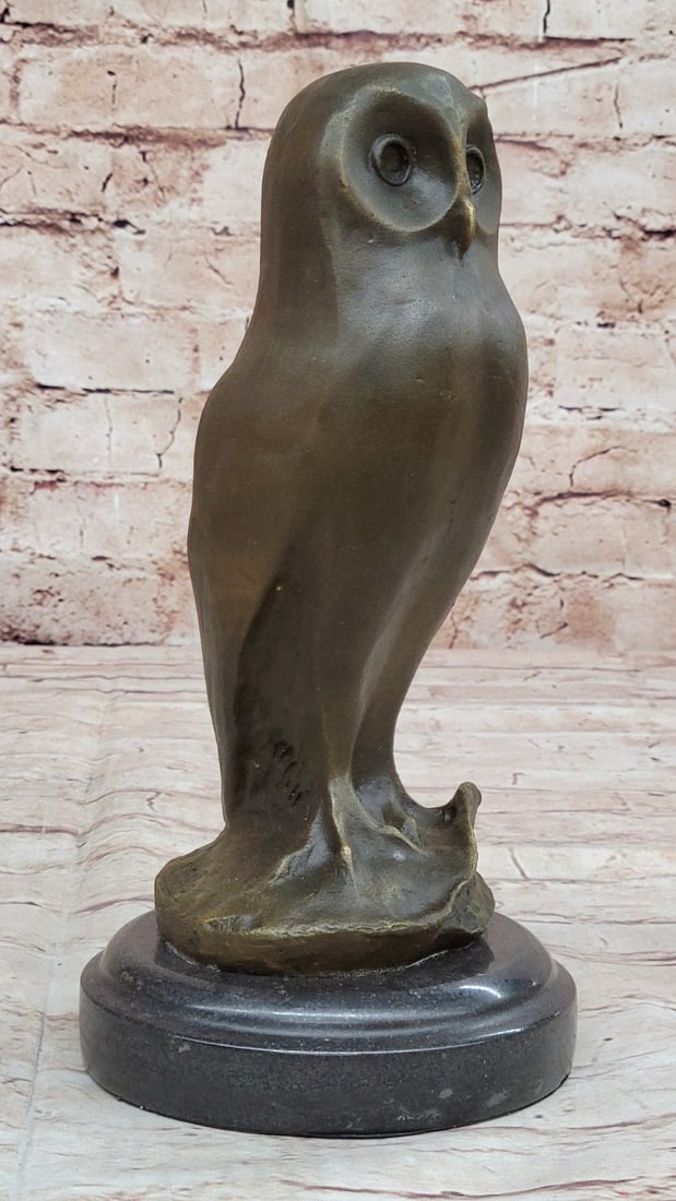 Owl Bronze Bird Sculpture: This owl is standing on a tree stump pedestal and is hand casted from a bronze patina to bring out the natural beauty of the bird. This is a beautiful bronze Owl, this would make a great centerpiece f