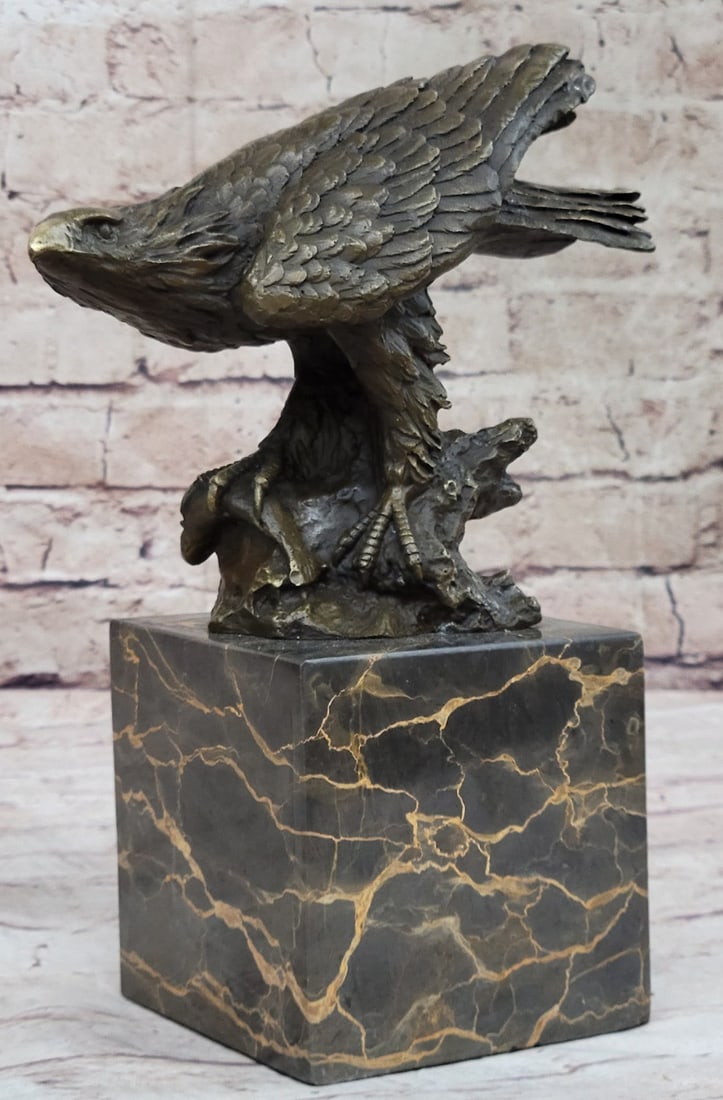 Animal Edition Bird Bronze Sculpture: This eagle lets time pass by as he rests atop a nest, he watches carefully as his prey comes at close range. He sits peacefully and patiently as his claws are spread out giving him a perfect balance t