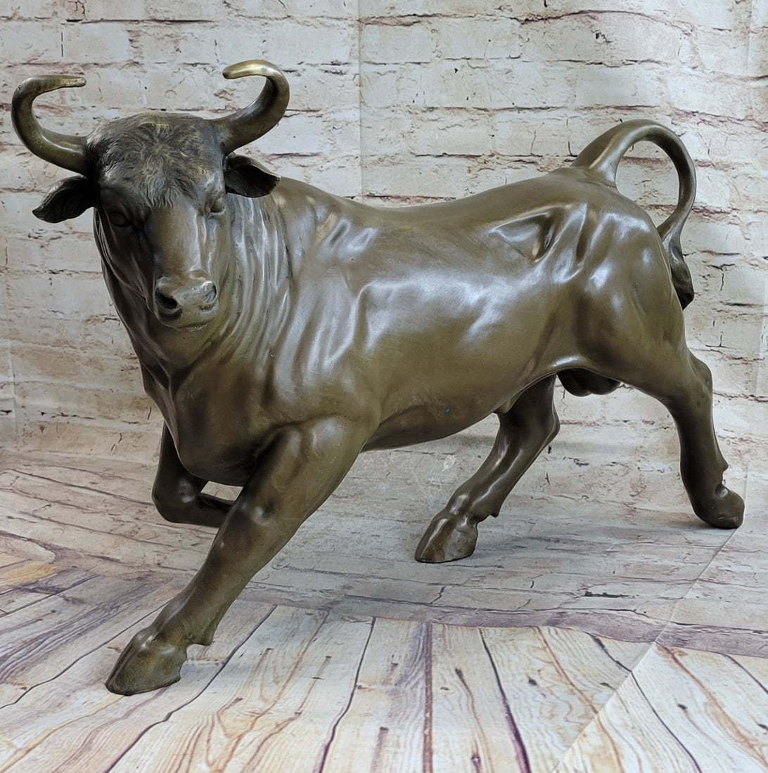 Stock Market Bull Genuine Bronze Sculpture: A mature bull walks briskly with his eyes keenly focusing in front of him. He is ready to charge powerfully at a matador that dares to test him. The curves on its body and wrinkles of the skin