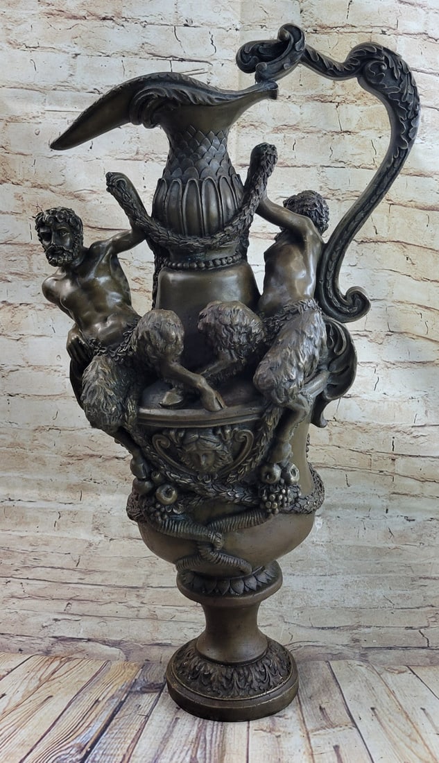 Two Centaur Urn Vase Bronze Sculpture: The "Dual Centaur Urn" is fraught with exquisite detail from its basket woven crown and detailed handle to its swags of fruits and flowers. Our exclusive heirloom sculpture alerts fellow gardeners