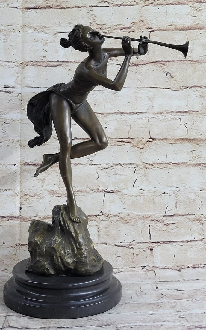 Sexy Nude Wood Nymph Playing Flute Bronze Sculpture: Sexy Woodnymph is singing and dancing positively elated with the sounds of the flute and beauty of the forest. The woman squats low to the ground and blows into her instrument as she clapping to the