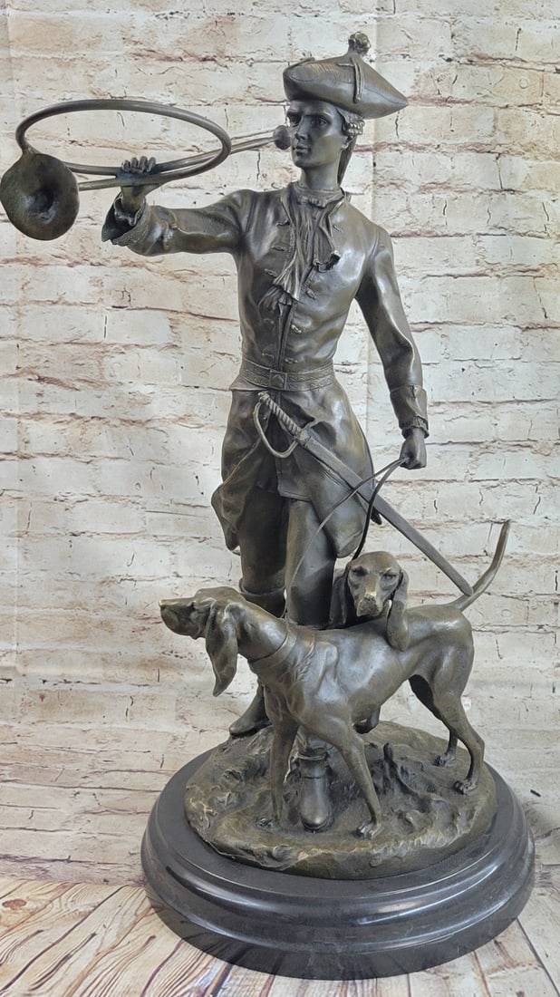 Hunter Soldier Bronze Statue: Elegant bronze casting of a French hunter flanked by two bloodhounds. Hunter has his bugle about to sound the clarion call to commence the hunt and Stands in at just under three feet tall so large