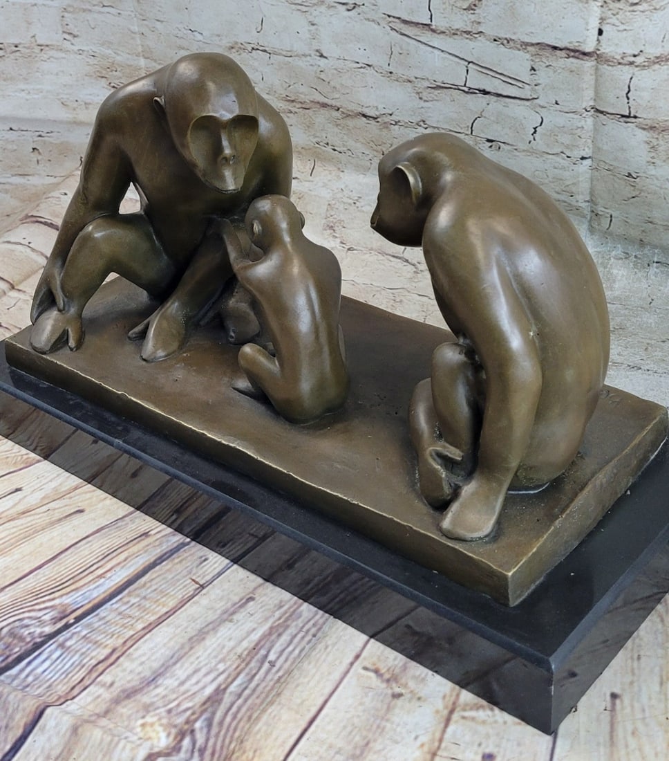Two Gorilla with Baby on Marble Base Bronze Figurine: Created from bronze metal, our artist has captured the protective and yet curious nature of this monkey family as Daddy baboon watches cautiously on. The detailing of this casting is phenomenal. it?s