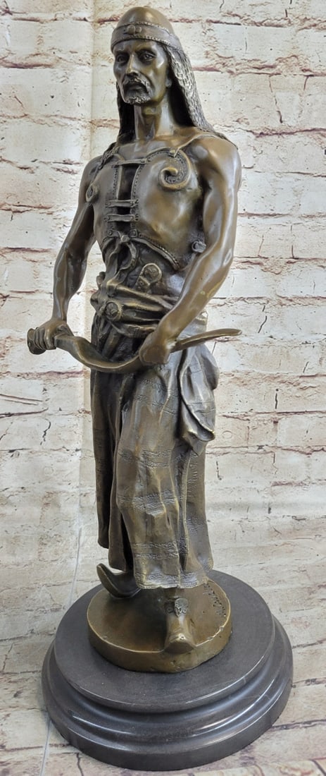 Hot Cast Bronze Sculpture: L`Emir" is a powerfully build, nomadic, middle eastern chieftain, suggestive of the type that fought against crusaders, his piercing eyes, beard, and broad shoulders, leather vest, and robe, long