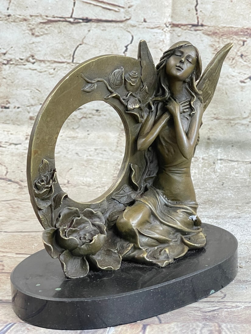 Fairy Bronze Sculpture on Marble Base Figurine: Daydreamers will fall in love with this daydreaming fairy. Filled with youthful curiosity, she wanders around the mystical forest, her eyes taking in all the magic around her. She is lulled by the