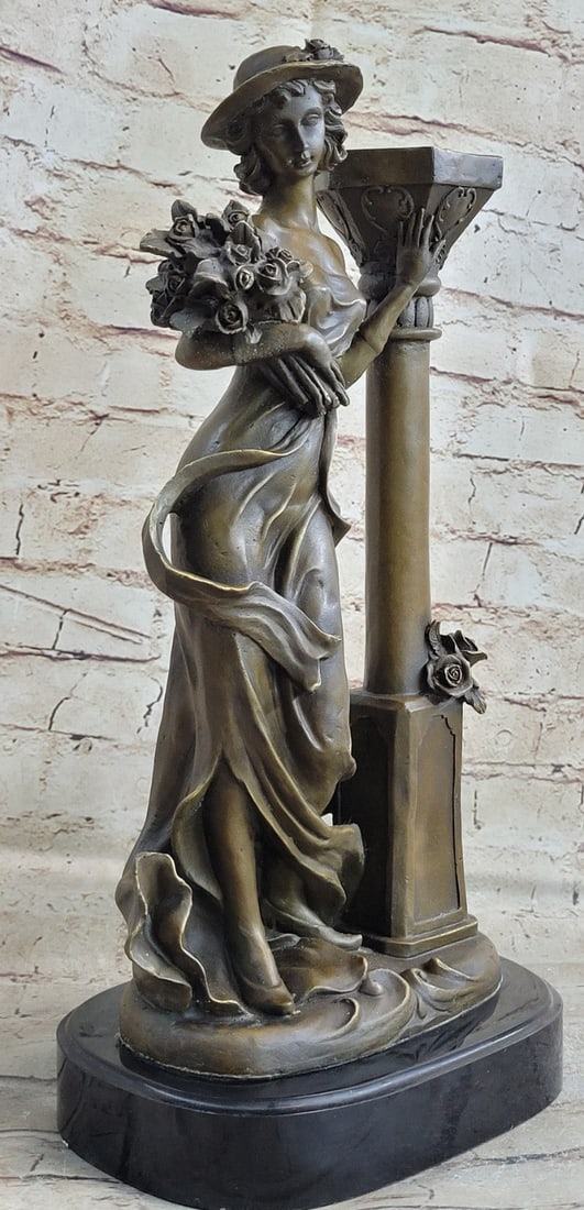 Lady Holding Bouquet of Flowers Bronze Sculpture: This Sculpture is unbelievable in details. This astonishing woman stands next to a pillar holding a bouquet of flowers. She has the most amazing and sexy body for a female, you can see her flat