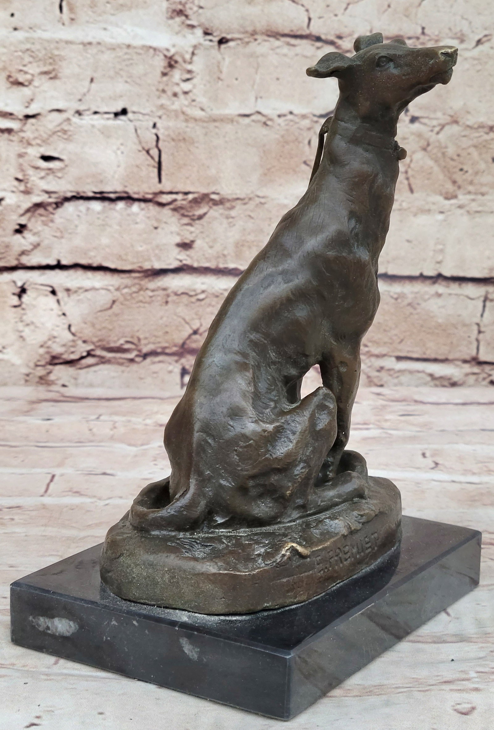 Greyhound Dog Bronze Sculpture: This dog statue has been carefully sculpted, every muscle and detail of the face and body has been attended to even the texture of the hair is evident. The dramatic depth of this sculpture is