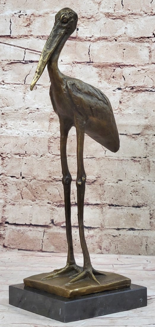Stork Exotic Bird Bronze Sculpture: This Bronze Sculpture is cast using the ancient Lost Wax Method in brown patina and mounted atop a marble base. Dimensions: Height 14 X Width 7 inches. Weight: 7 LBS.
