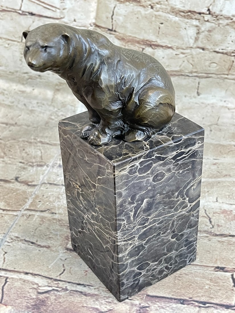 Polar Bear Wildlife Bronze Sculpture: This amazing animal figurine is a great and very lifelike Bronze of a wild and powerful polar bear, sitting on a brown marble base. This Bronze sculpture was cast using the lost cast method with