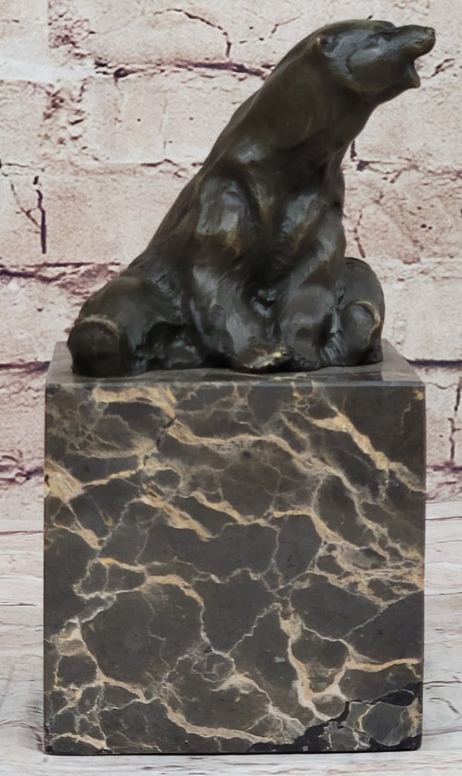 Polar Bear Bronze Sculpture: This amazing animal figurine is a great and very lifelike bronze of a wild and powerful polar bear, sitting on a brown marble base. The figure is made of bronze and mounted on a marble base. Dimension