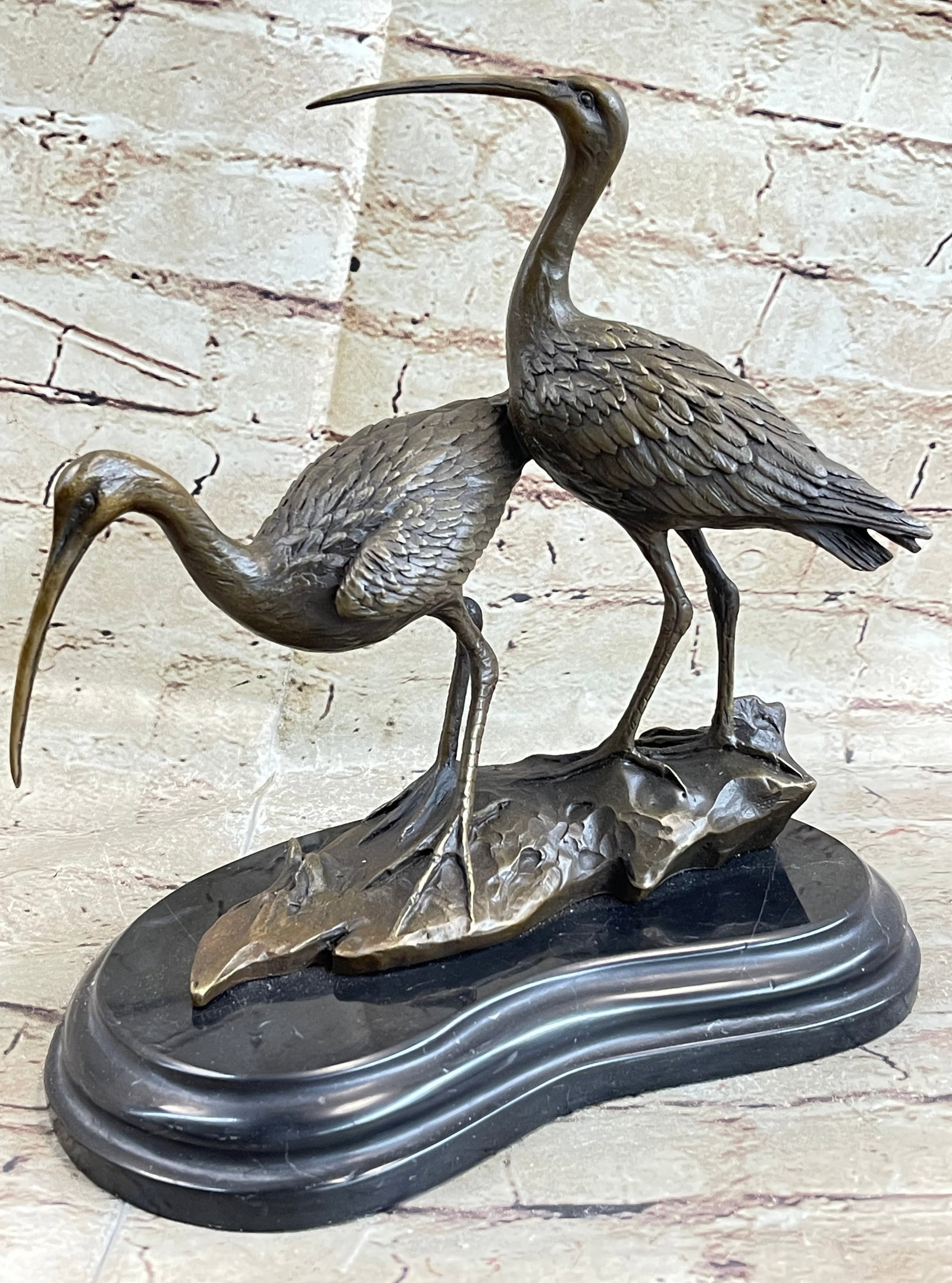 Two Wildlife Cranes Pond Bronze Sculpture: Add some wildlife to your pond or garden with this beautiful Statue of two cranes standing on a log. The Statue is enhanced with a variety of patinas and polishing to add color and visual contrast to 