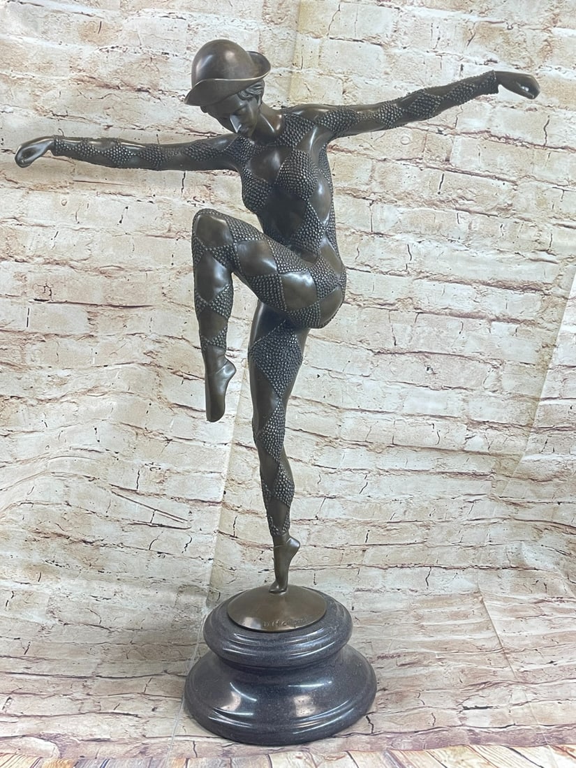 Dancer Bronze Sculpture: An exciting bronze study of a dancer in dramatic balanced pose and wearing a full dance costume from the Paris Dance Halls of the Art Deco era. The figure is raised on a marble base. Dimensions: