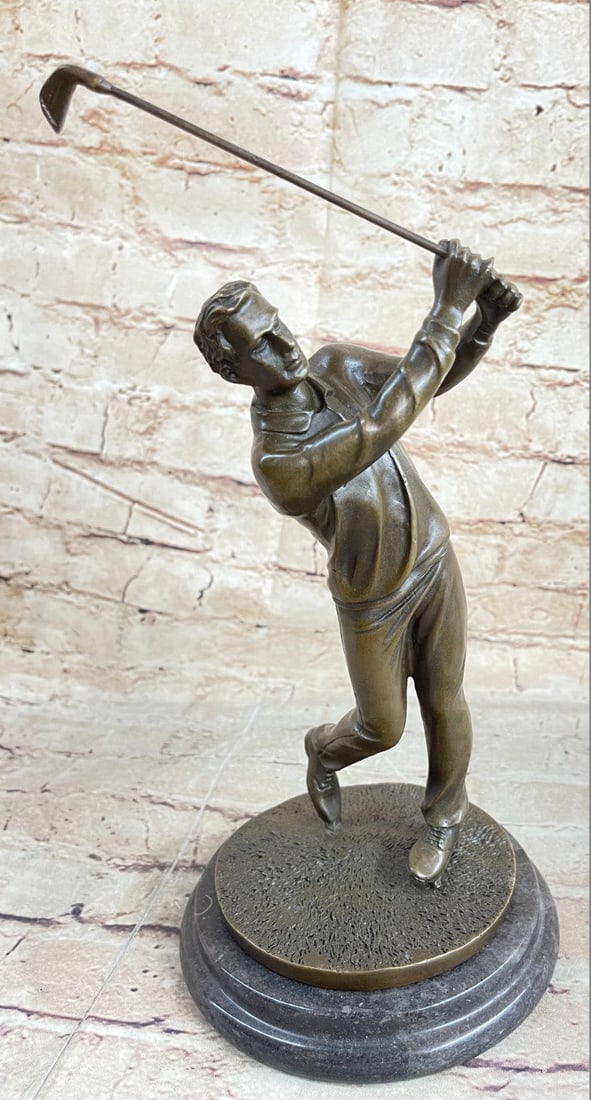 Golfing Trophy Bronze Statue: A golfer tilts his head up to the sun and watches his ball rise. He holds his form and stance, tracking the position of the ball and how close to the green it may land. His body twists with his stroke