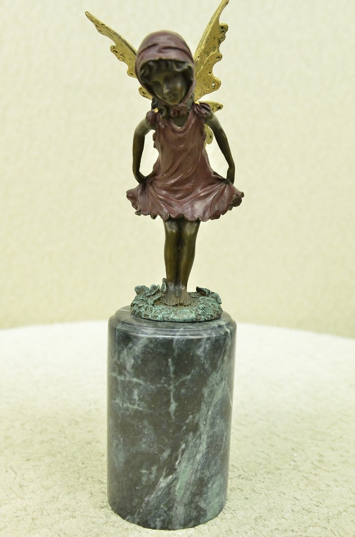 Guardian Butterfly Angel Bronze Figure: Daydreamers will fall in love with this daydreaming fairy. Filled with youthful curiosity, she wanders around the mystical forest, her eyes taking in all the magic around her. She is lulled by the