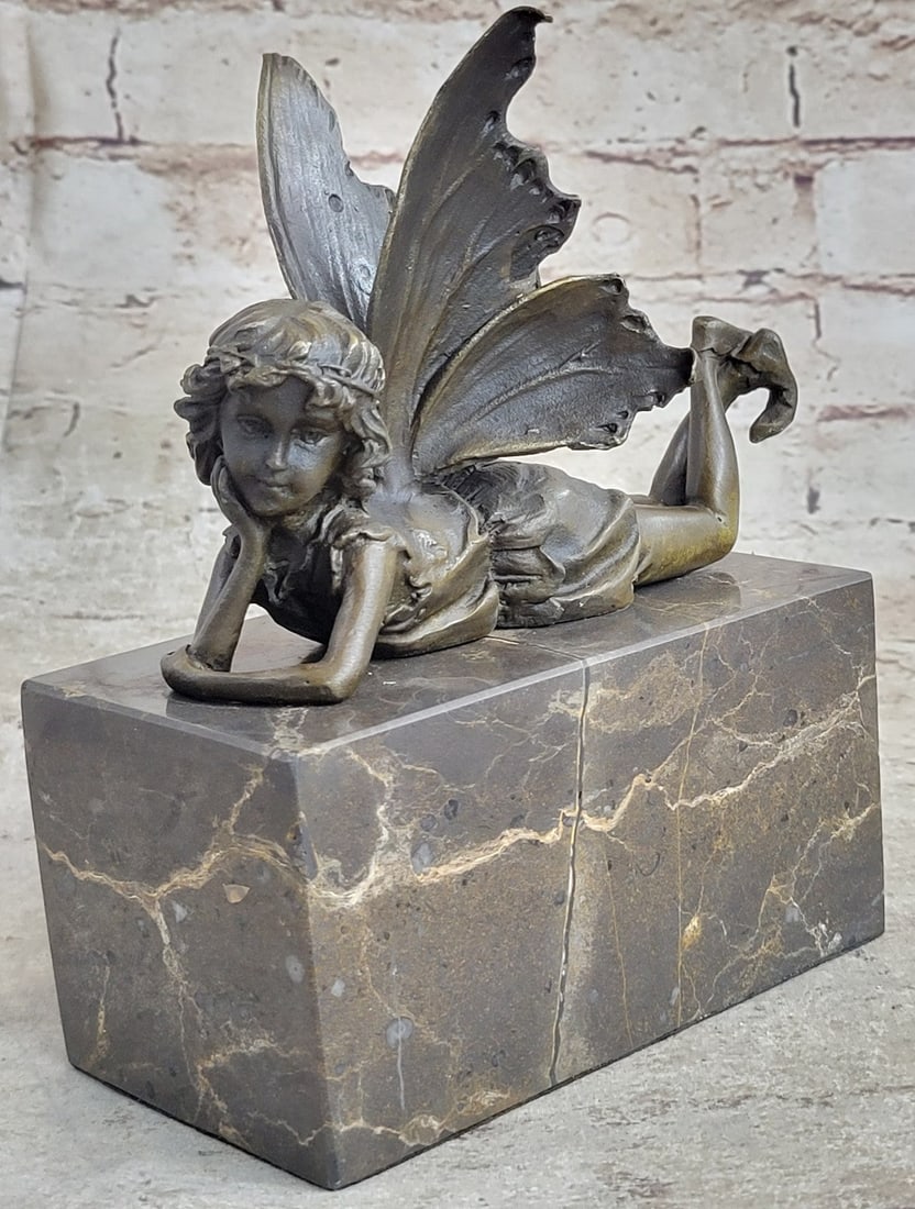 Angel Cherub Gild Bronze Statue: Daydreamers will fall in love with this daydreaming fairy. She sits lazily in her mystical forest, her eyes taking in all the magic around her. She is lulled by the soft sounds of life and fantasy