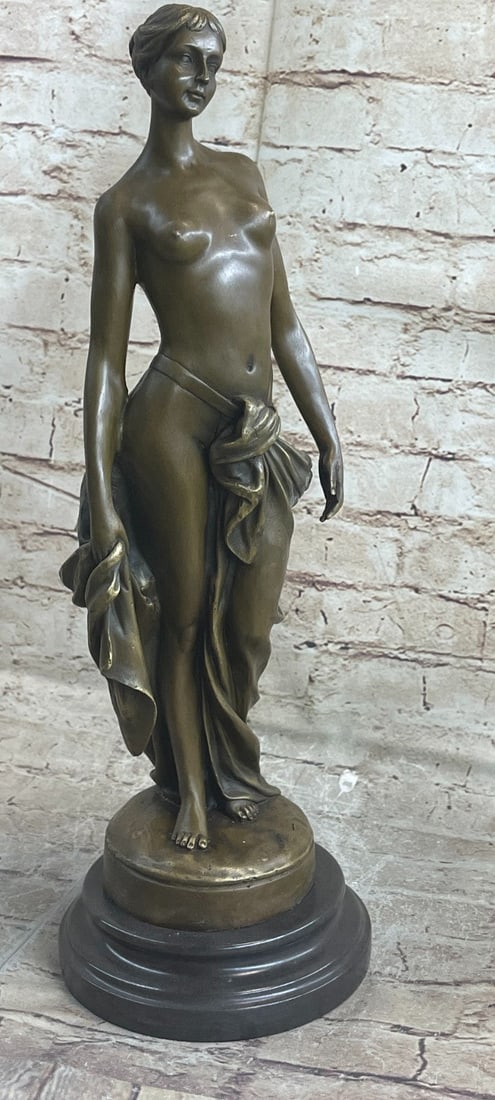 Nude Girl Bronze Sculpture: Smooth finish, perfect in every detail, even down to her tiny fingernails. She stands semi-nude with a nonchalant expression if daring you to turn away.?This bronze sculpture was cast using the Lost W