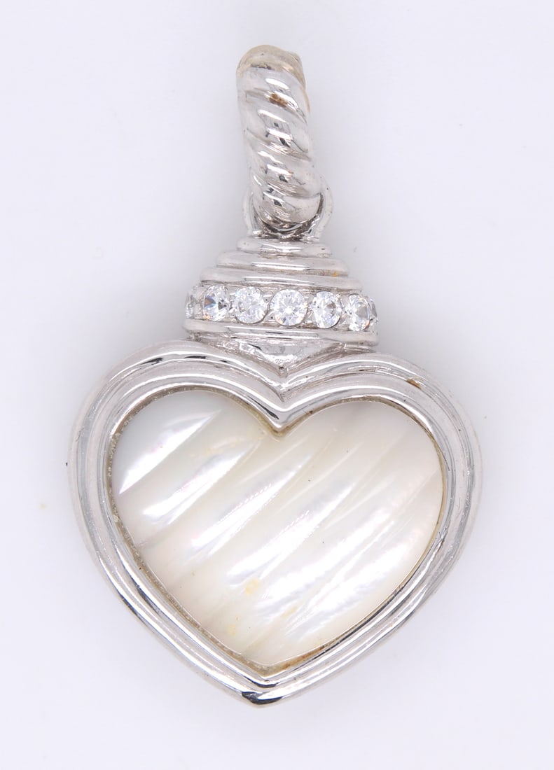Judith Ripka mother of pearl and CZ heart shaped pendant: Judith Ripka mother of pearl and CZ heart shaped pendant in 925 sterling silver. Total weight of pendant 14.1 grams.