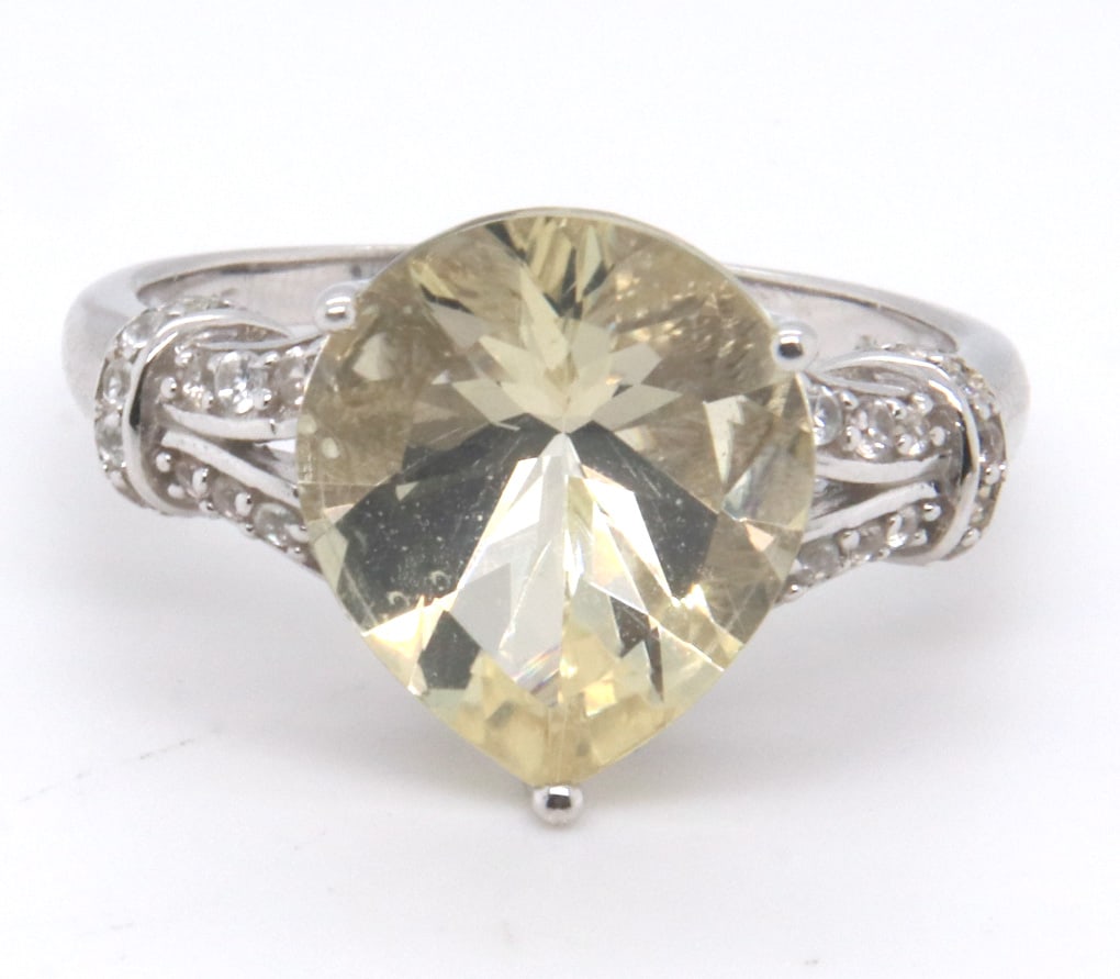 Sterling Silver Pear Shaped Yellow Cubic Zirconia Ring: 925 Sterling Silver Pear Shaped Yellow Cubic Zirconia Ring. Total weight of Ring 6.34 Grams. Ring Size 11"