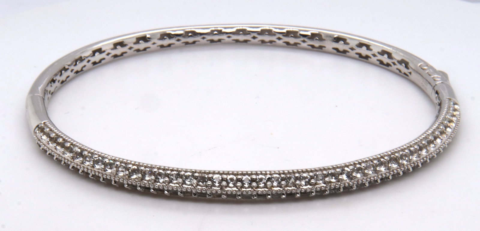 Vinatge Sterling Silver Cubic Zirconia Bangle: Vintage 925 Sterling Silver Cubic Zirconia Bangle. Total weight of Bangle 17.54 Grams.