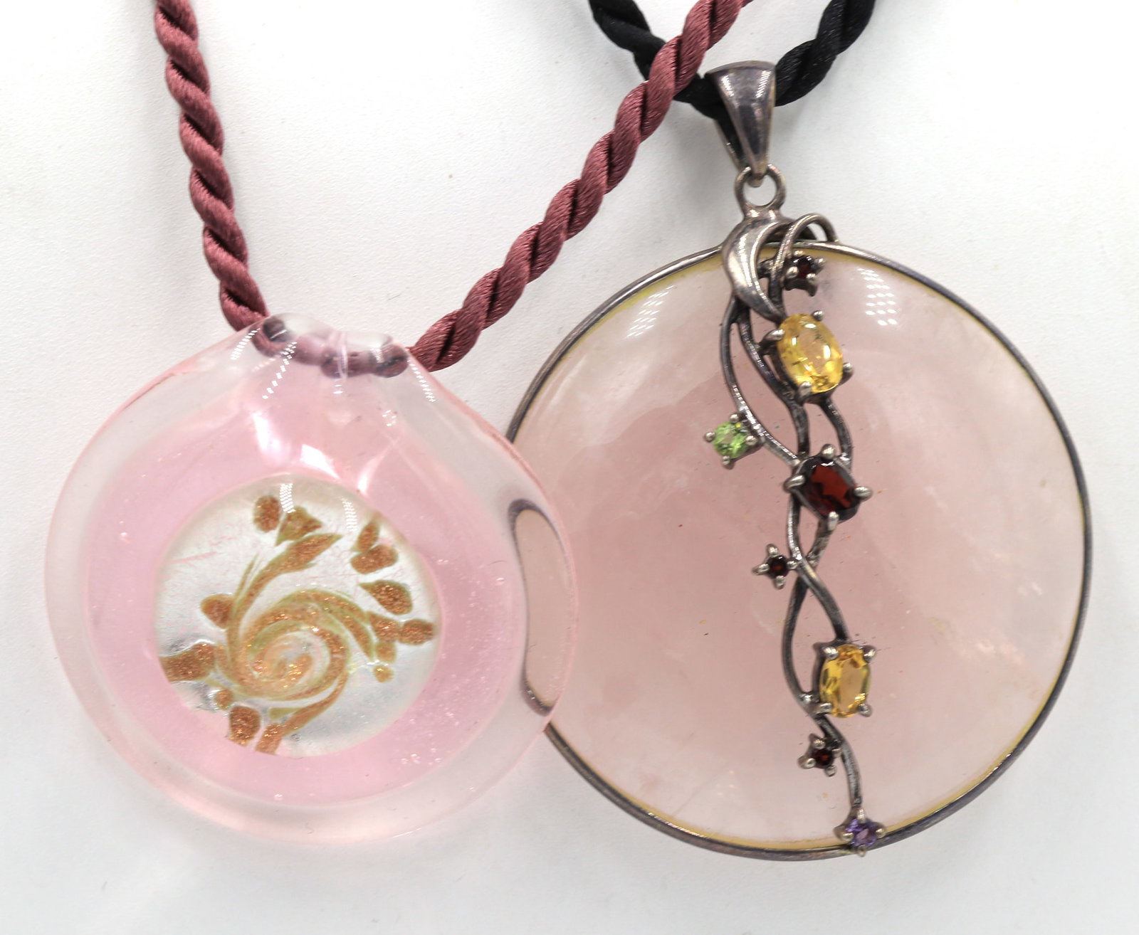 Group lot of 2 rose quartz pendants on cord necklaces: Group lot of 2 rose quartz pendants on cord necklaces. Total weight of lot is 75.9 grams.