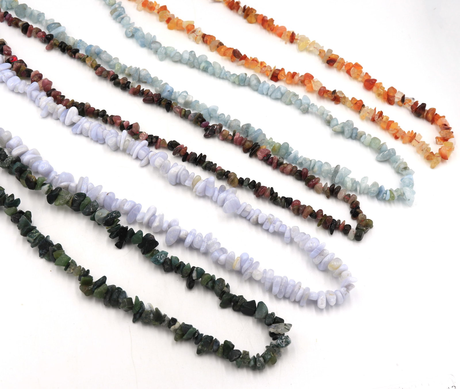 Group lot of multi colored chip stone necklaces: Group lot of multi colored chip stone 34 inches necklaces. Total weight of lot is 320.4 grams.