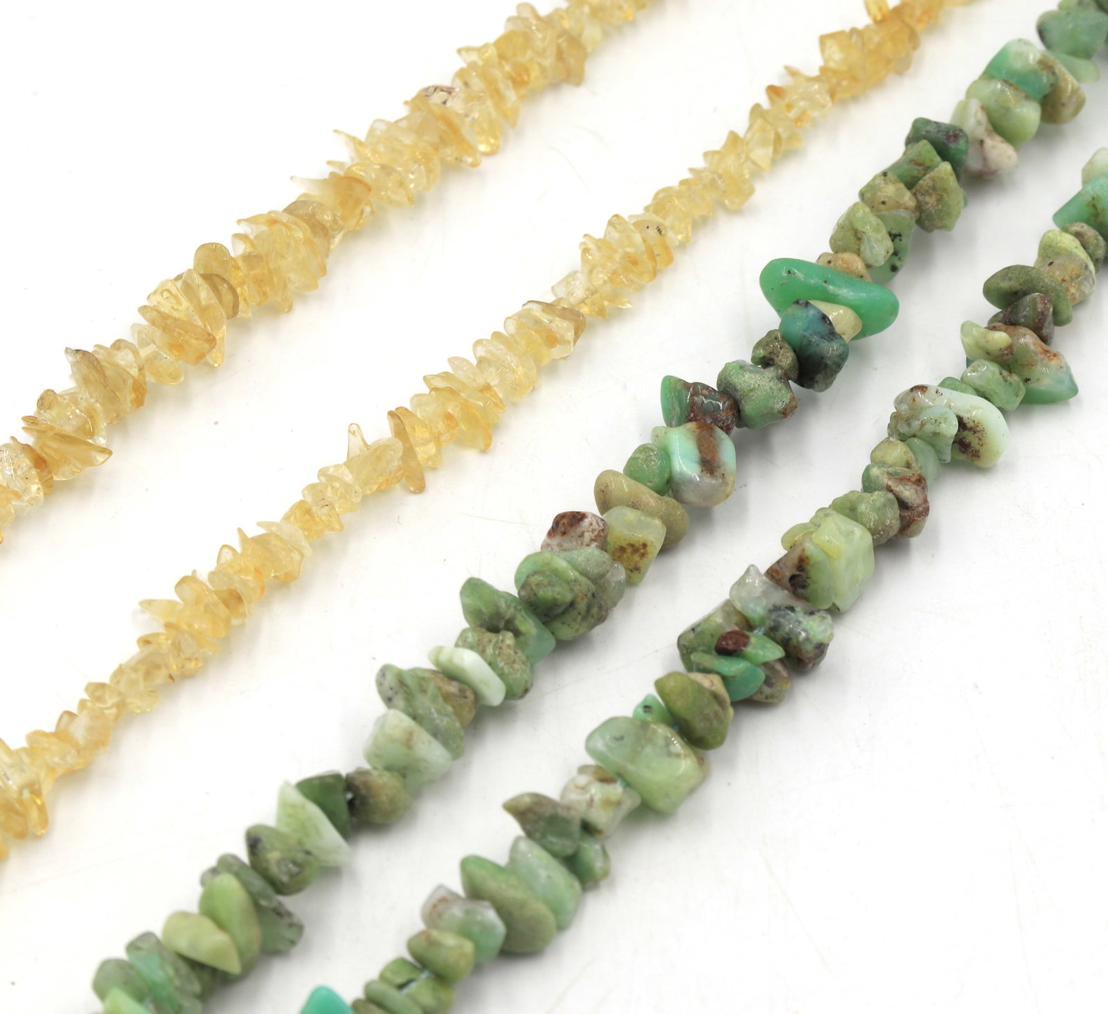 Group lot of 2 chip stone necklaces: Group lot of 2 chip stone 34 inches necklaces. Total weight of lot is 116.9 grams.