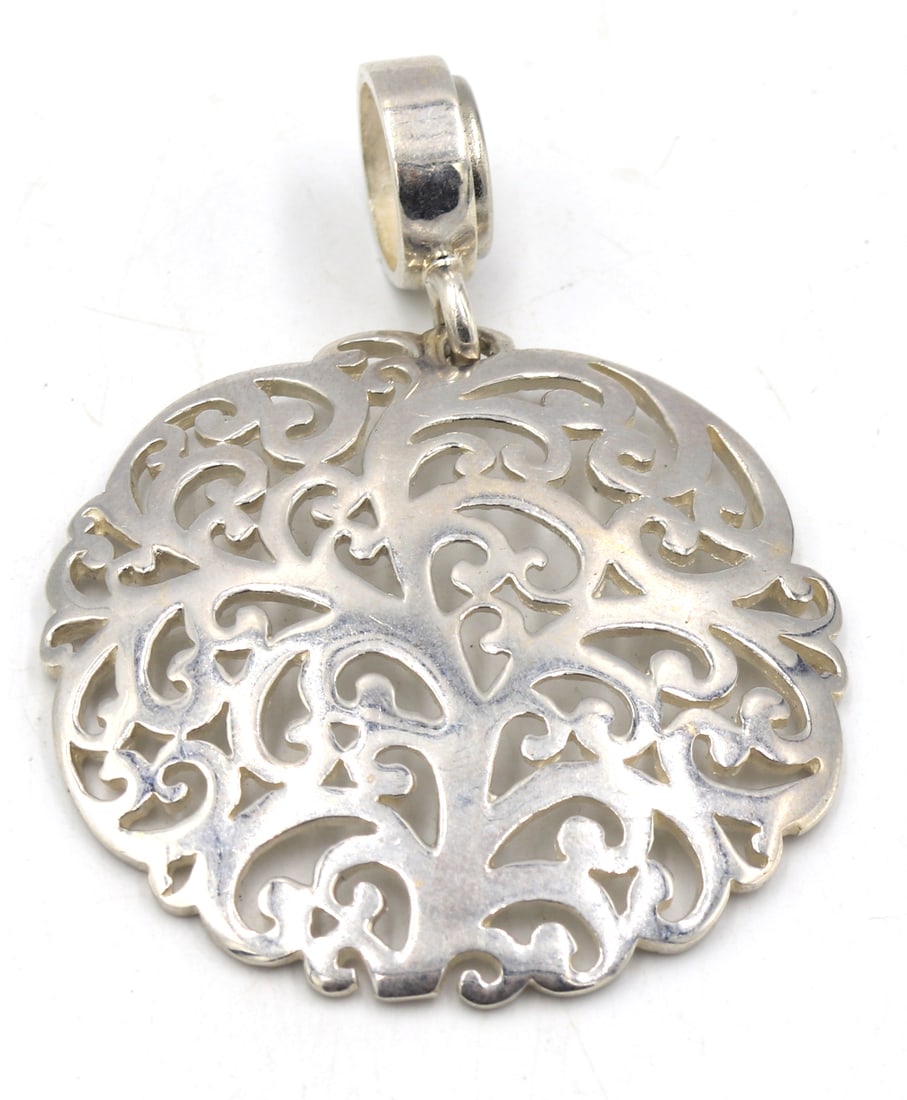925 Sterling silver signed filigree round pendant: 925 Sterling silver signed filigree round pendant. Total weight of pendant is 15.5 grams.