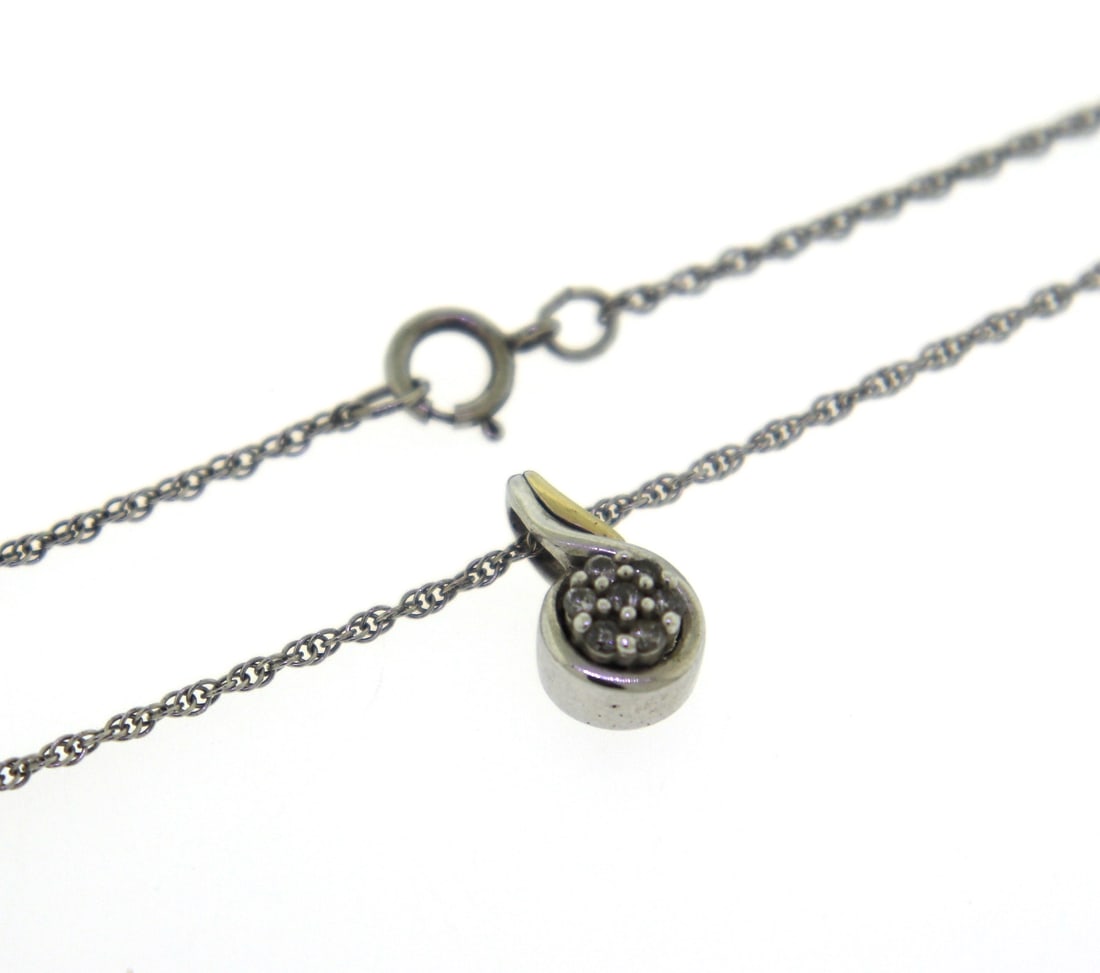 925 Sterling Silver Pendant on Chain: 925 Sterling Silver Pendant on 18' Chain Necklace with 14kt Yellow Gold accents. 3.44 Grams.