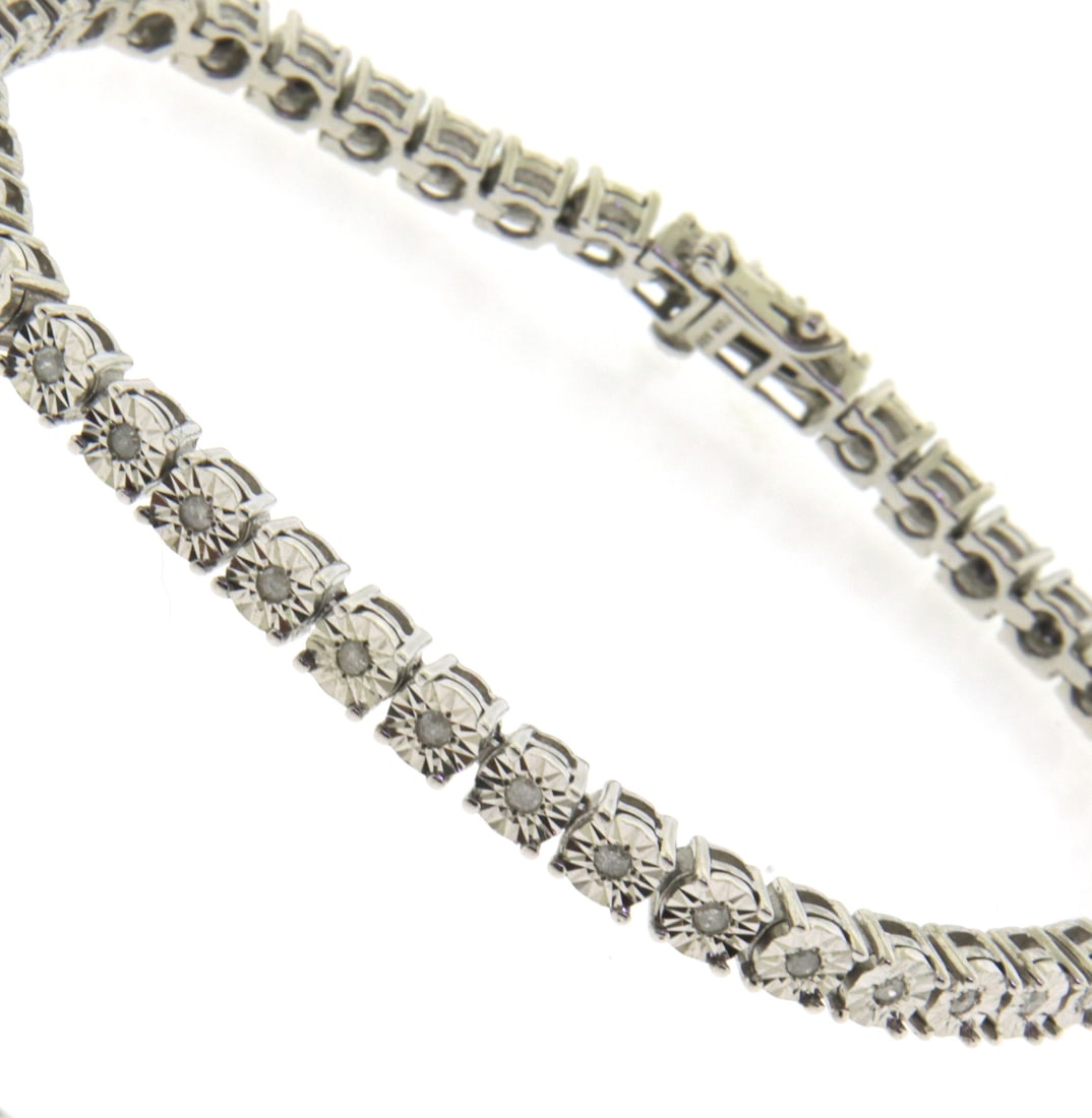 925 Sterling Silver Cubic Zirconia Tennis Bracelet: 925 Sterling Silver Cubic Zirconia 7" Bracelet. Total weight of Bracelet 14.30 Grams.