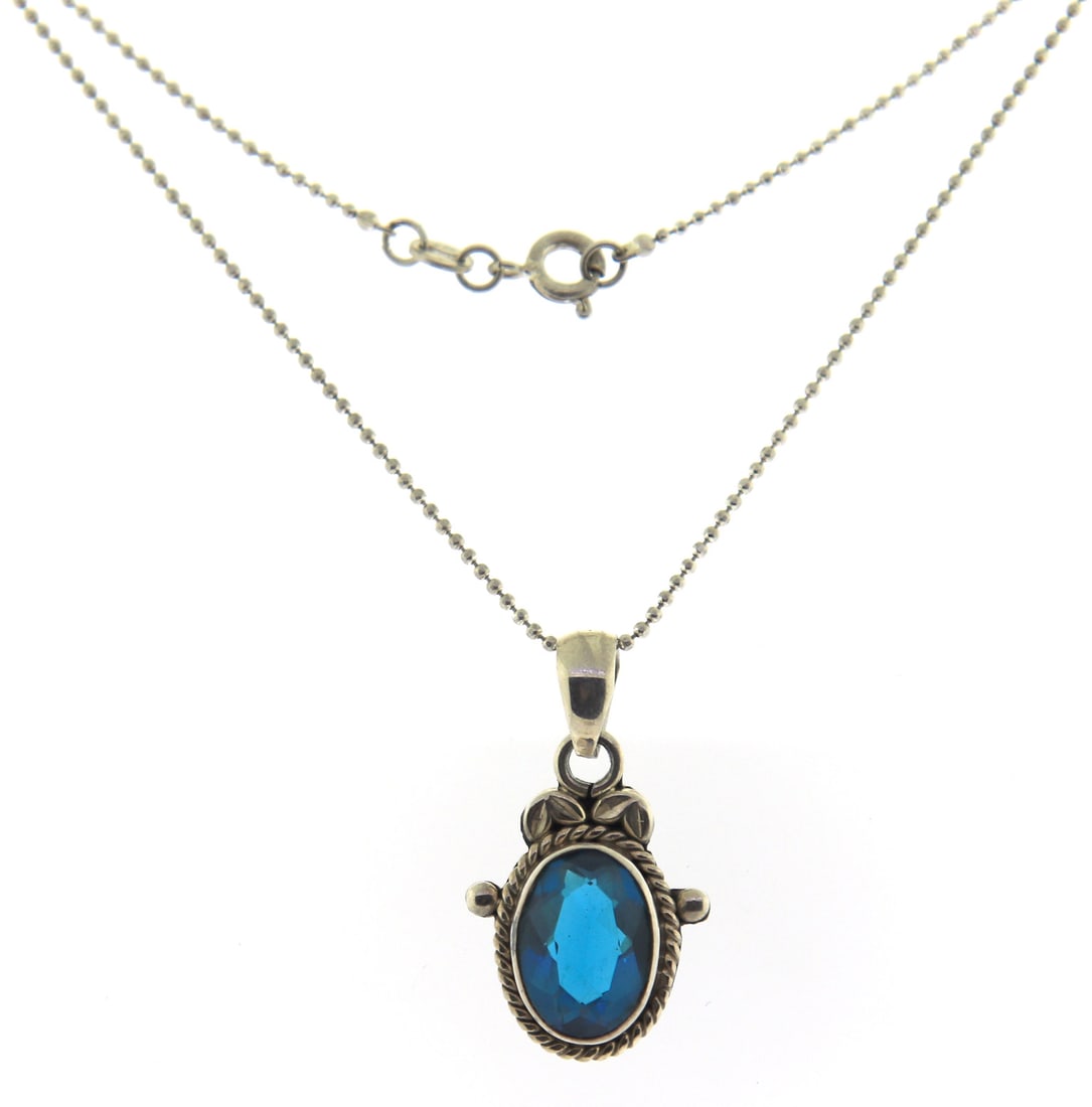 Sterling Silver Blue Glass Pendant on Chain: 925 Sterling Silver Blue Glass Pendant on 18" Chain Necklace. Total weight of Necklace 7.50 Grams.