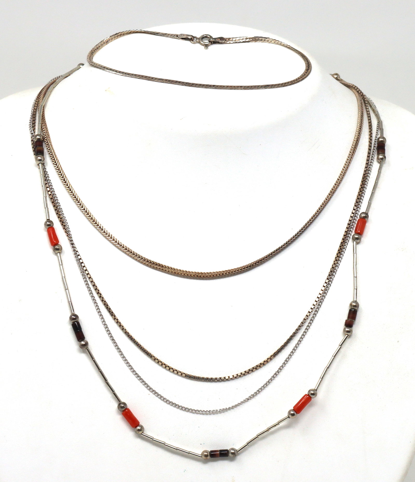Group lot of Vintage 925 sterling silver 4 chains and bracelet: Group lot of Vintage 925 sterling silver 4 chains and 7-inch herringbone bracelet. Total weight of lot is 14.80 grams.
