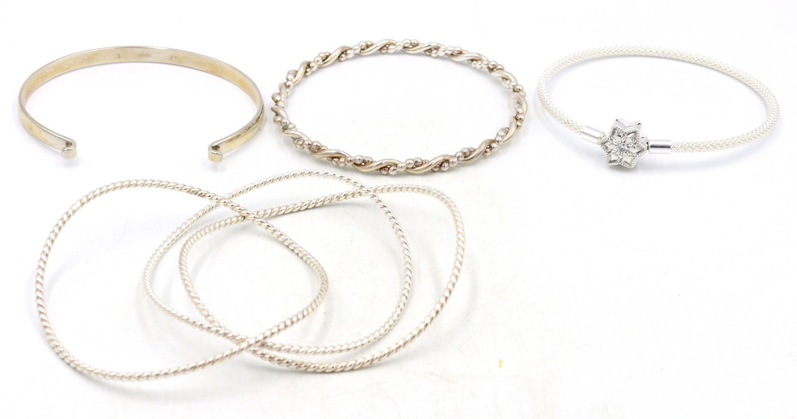 Group lot of 925 sterling silver bangles: Group lot of 925 sterling silver bangles. Total weight of lot is 56.9 grams.