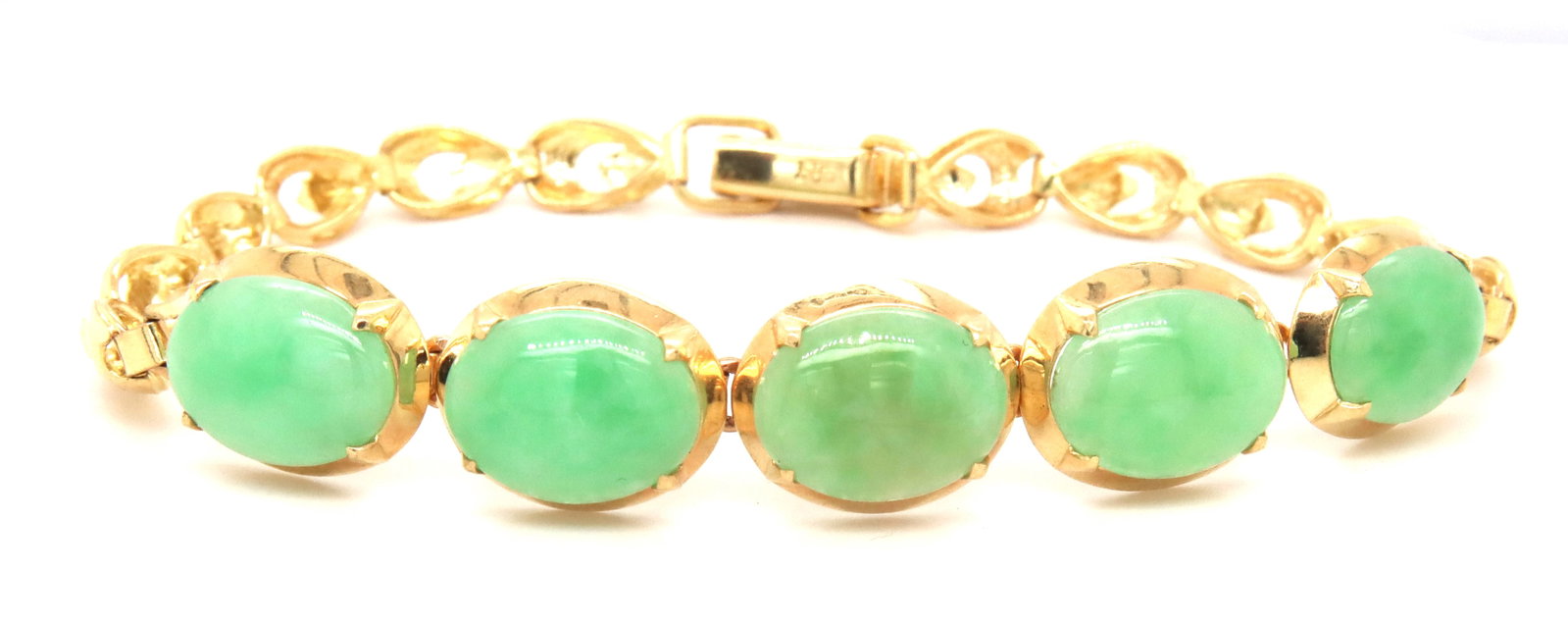 14kt Yellow gold green Jade link bracelet: 14kt Yellow gold green Jade link 7-inch bracelet. The total weight of the bracelet is 9.8 grams.