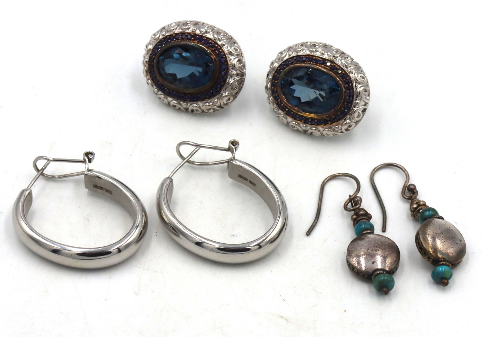 3 Pairs of 925 sterling silver earrings: 3 Pairs of 925 sterling silver earrings. The total weight of the lot is 24.9 grams.