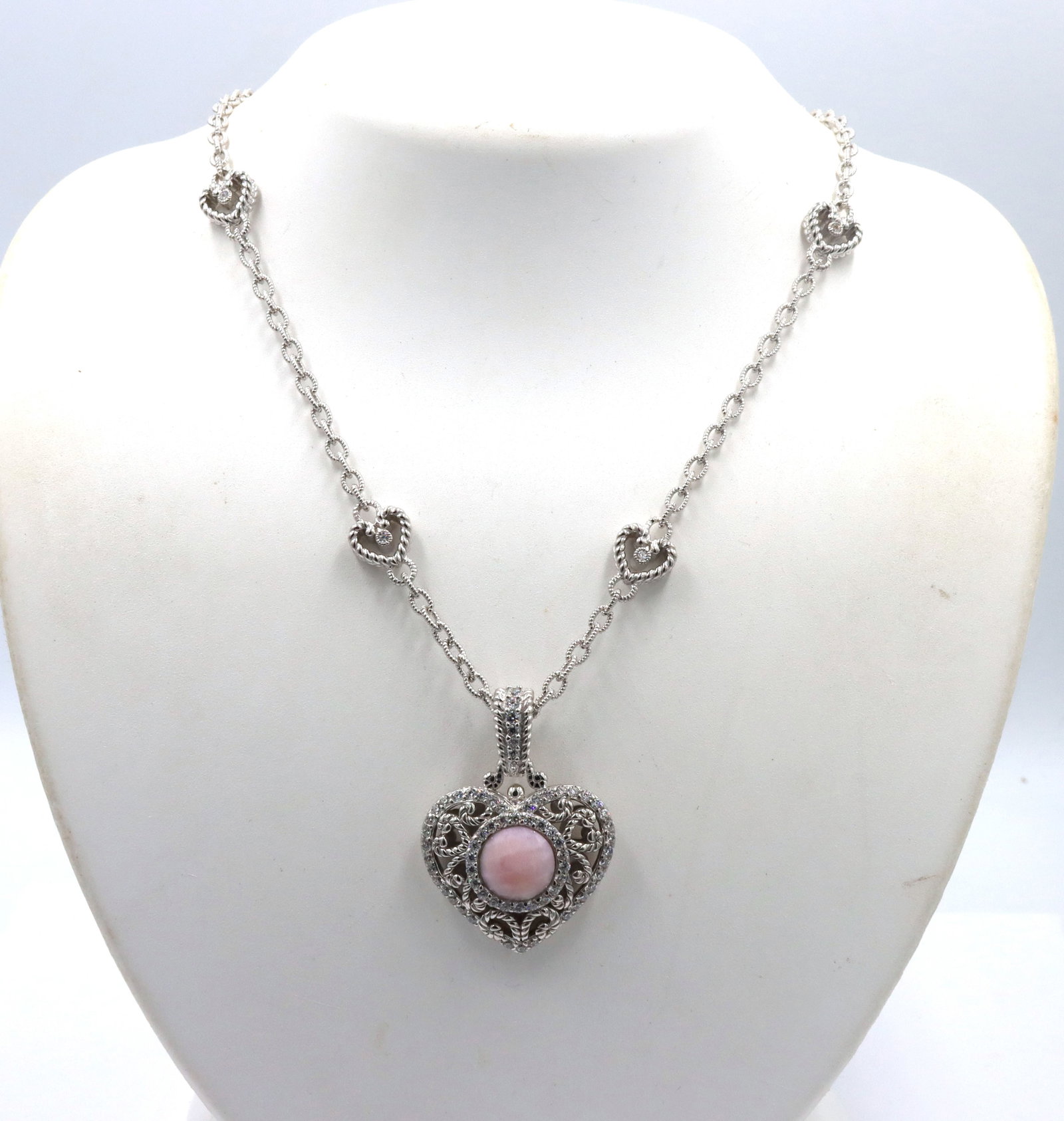 Judith Ripka silver heart station necklace with pink quartz heart enhancer: Signed Judith Ripka silver heart station 18-inch necklace with pink quartz heart enhancer. The total weight of the necklace is 33.9 grams.