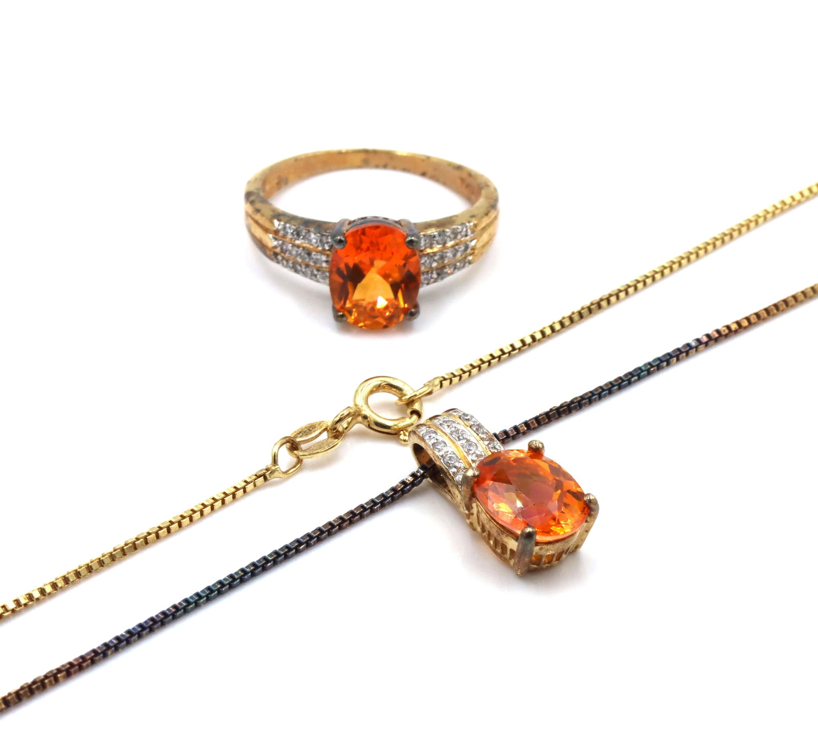Set of 925 sterling silver orange stone pendant on Italian box chain necklace and matching ring: Set of 925 sterling silver orange stone pendant on 18-inch Italian box chain necklace and matching ring. Total weight of the set is 9.9 grams. Ring size 10.25".