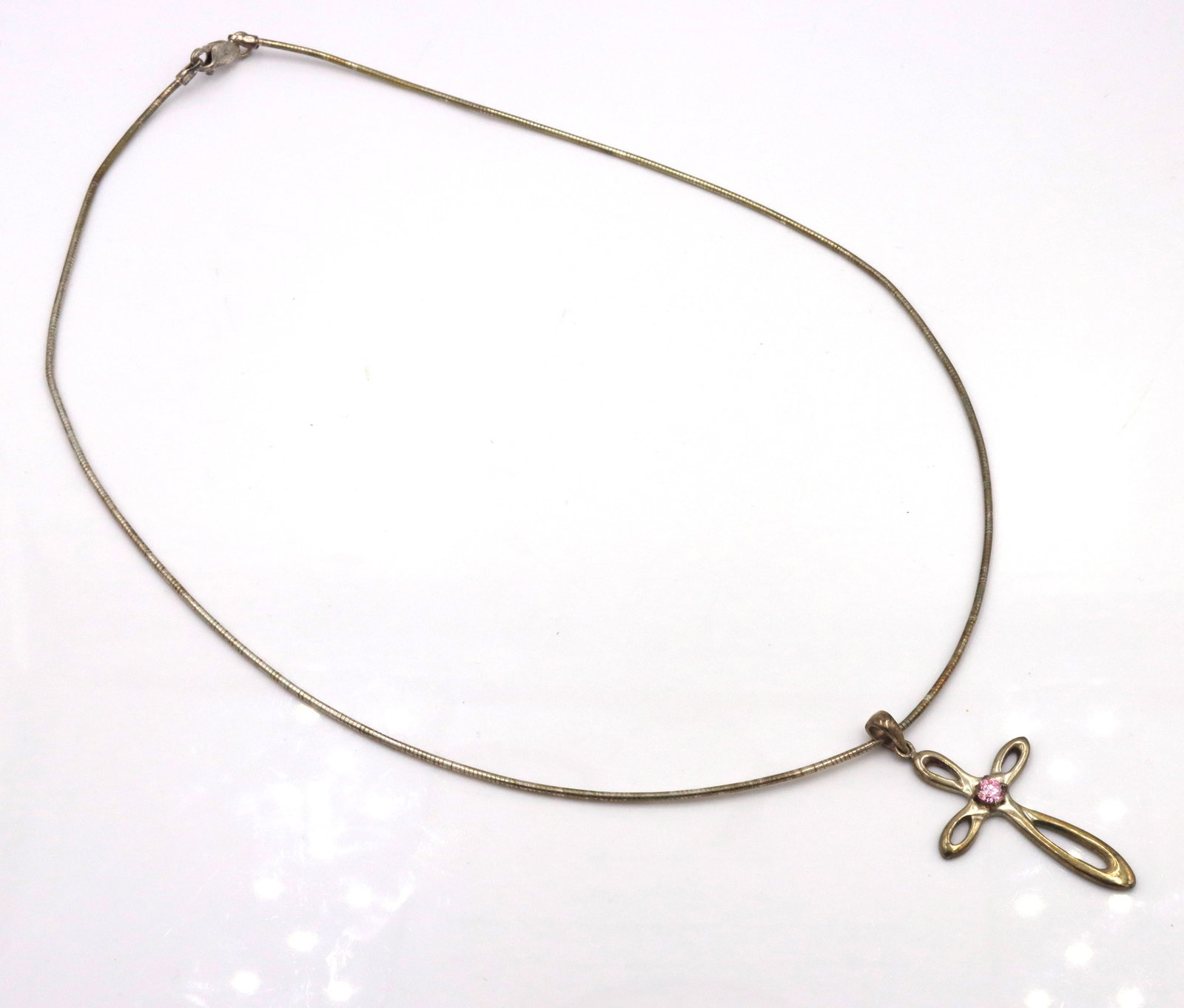 925 Sterling silver Cross pendant on Italian omega chain: 925 Sterling silver Cross pendant on 17-inch Italian omega chain necklace. The total weight of the necklace is 8.3 grams.
