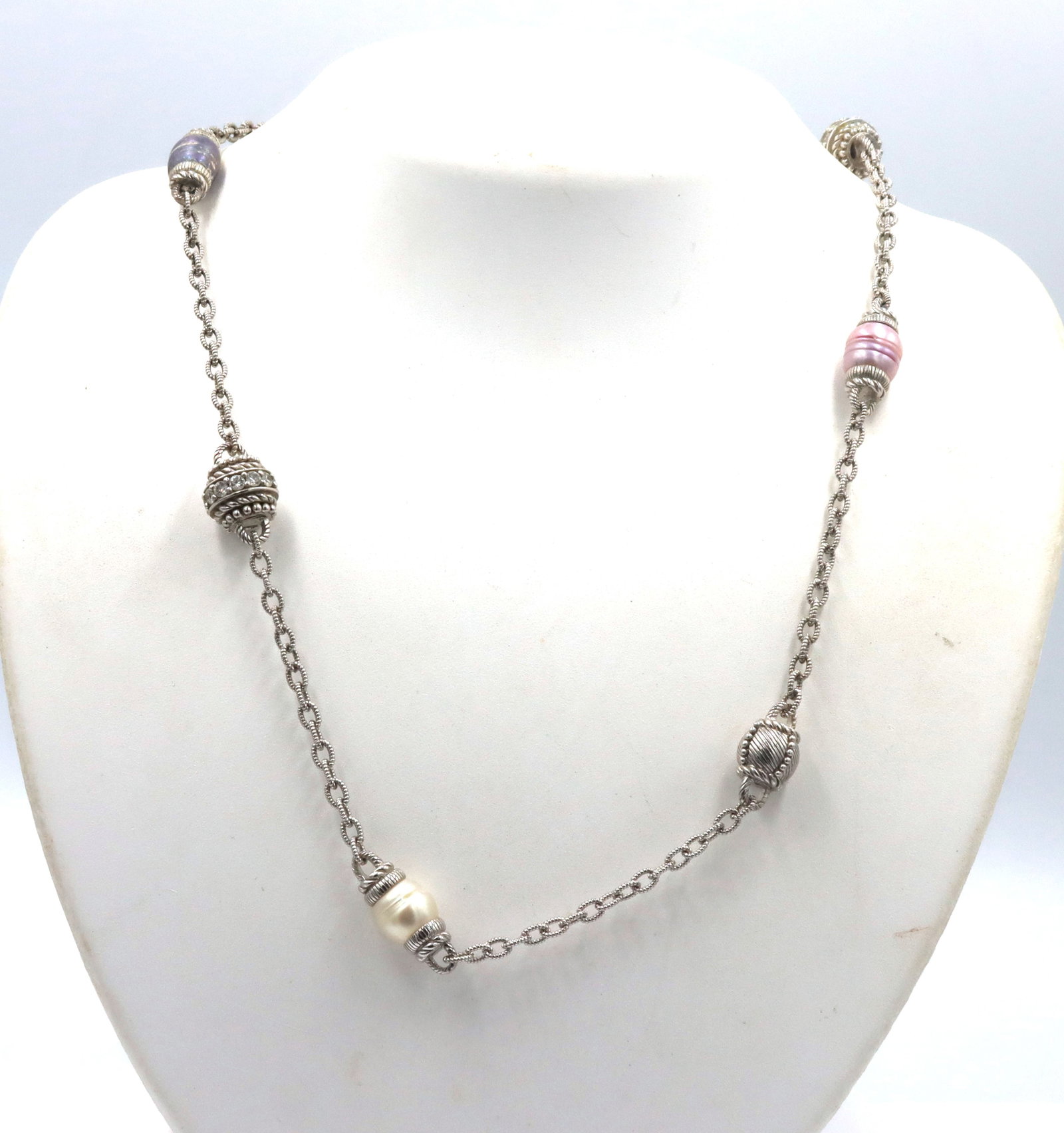 Judith Ripka Pink, Blue and White Pearls and Cubic Zirconia Station necklace: Vintage Estate Judith Ripka Pink, Blue and White Pearls and Cubic Zirconia Station 925 Sterling Silver 36-inch Necklace. The total weight of the necklace is 57.7 grams.