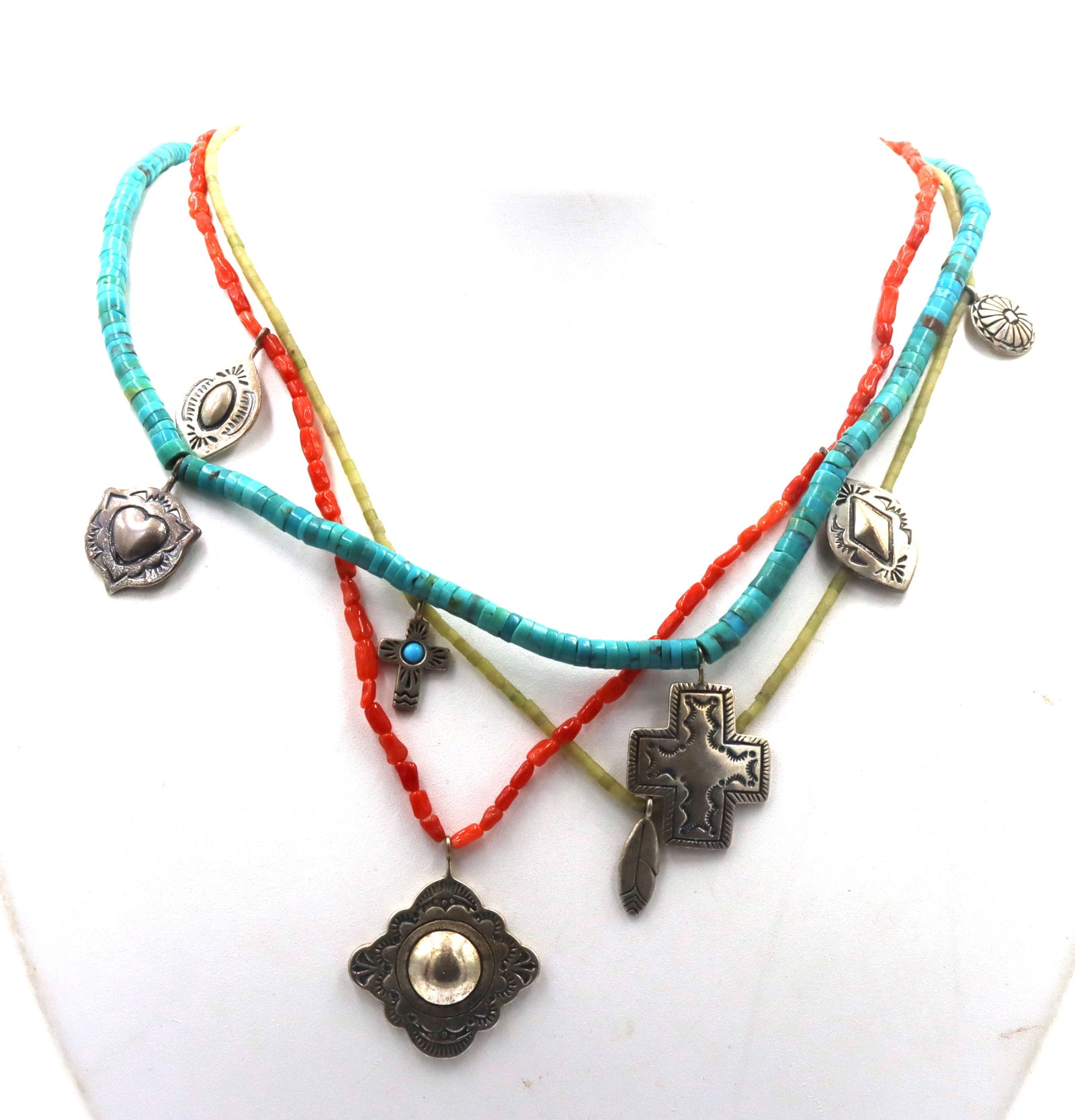 American Indian Navajo 3 strand turquoise and coral necklace with charms: American Indian Navajo 3 strand turquoise and coral 20-inch necklace with charms. The total weight of the necklace is 31.1 grams.