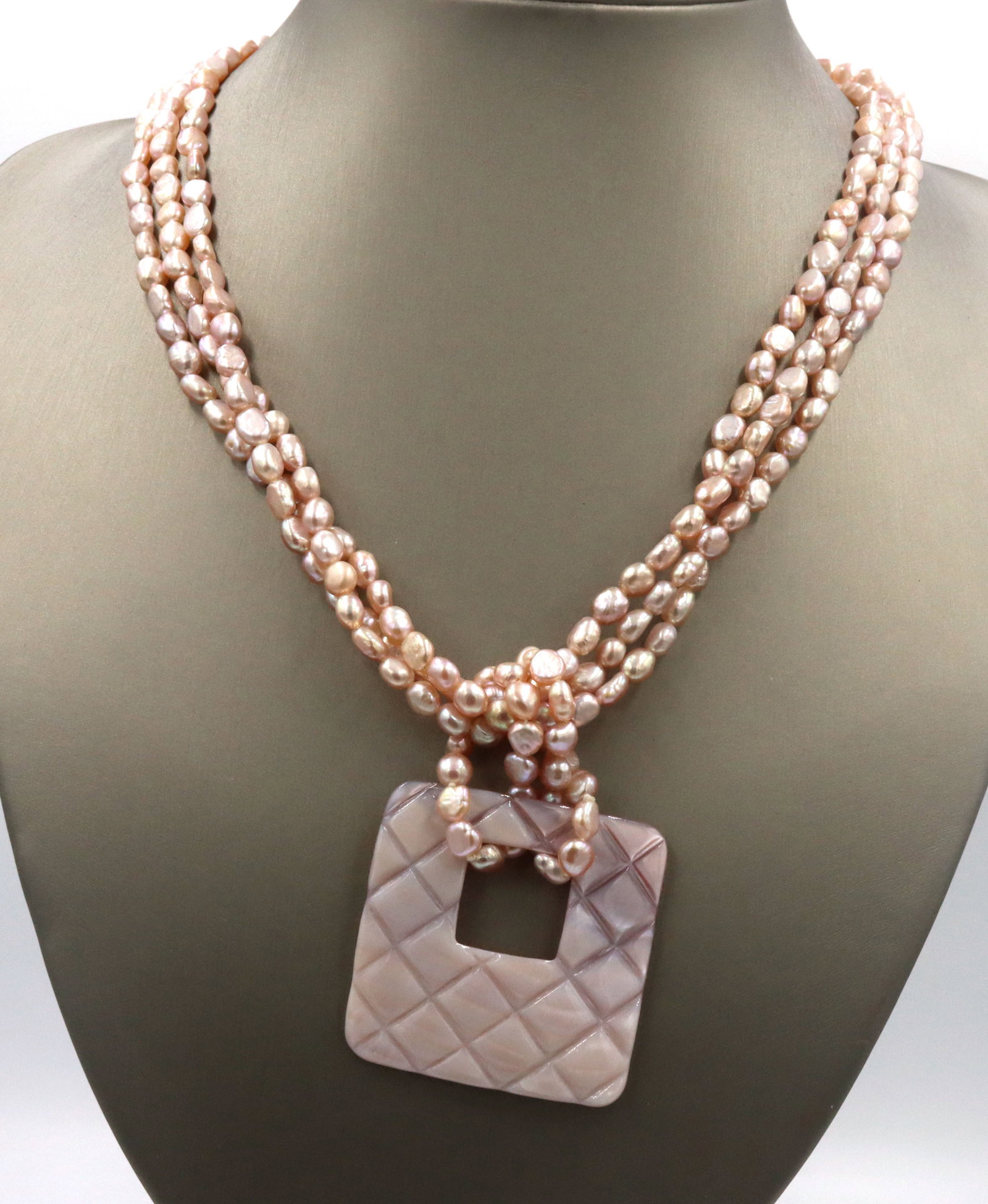 Pearl square pendant on multi strand pearl necklace: Pearl square pendant on multi strand pearl 18-inch necklace with 925 sterling silver lobster clasp. The total weight of the necklace is 59.3 grams.