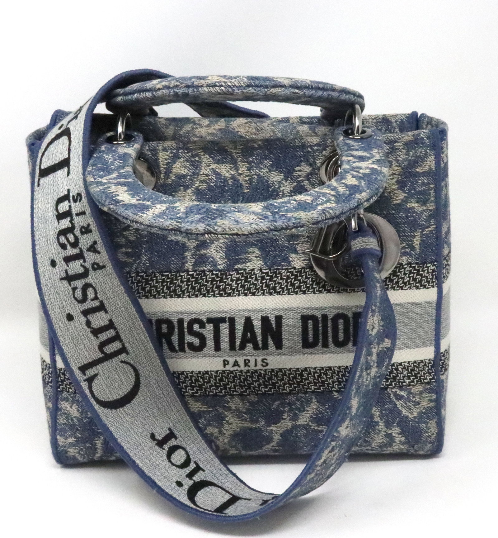 Dior blue off white Cannage Embroidered Canvas medium lady D lite tote: Authentic Christian Dior blue off white Carnage Embroidered Canvas medium lady D lite tote with top handles and shoulder strap. 9" long. Made in Italy.