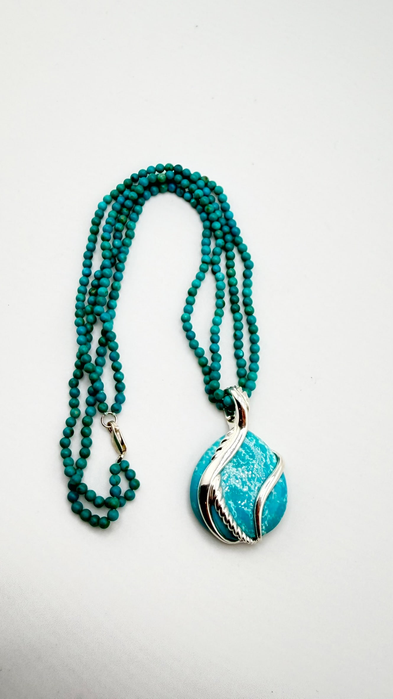 925 Sterling Silver Turquoise Pendant With bead Chain Necklace: 925 sterling silver Turquoise pendant with a pretty layering design and a small turquoise bead necklace.30 grams