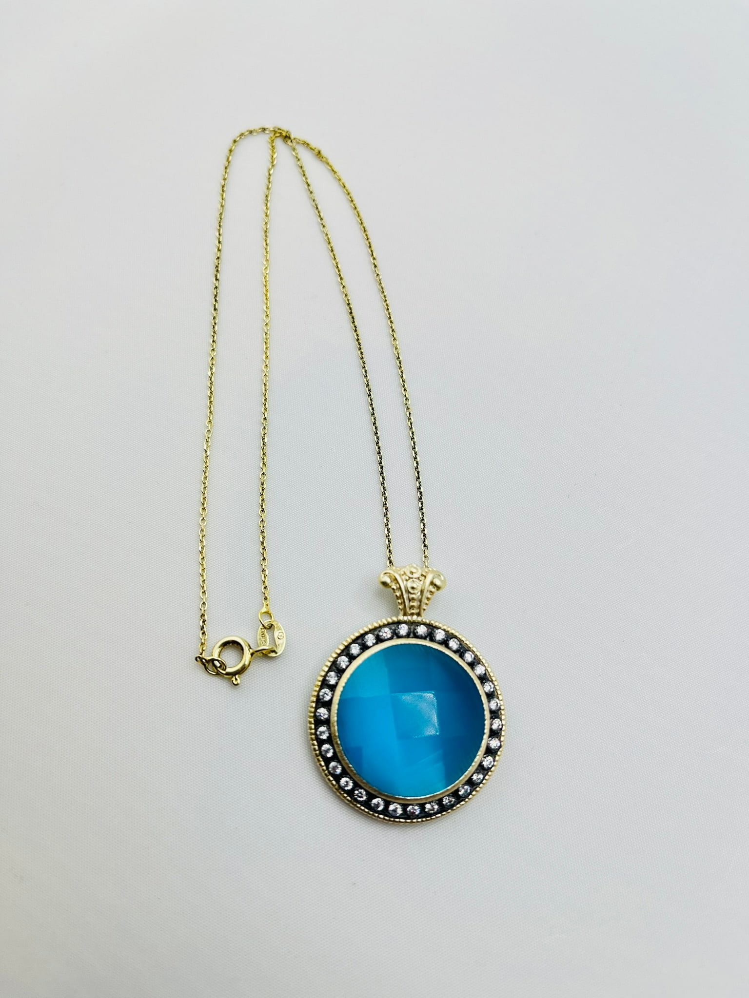 925 Sterling Silver Round Blue Pendant With Crystal Pave Details and Chain: 925 sterling silver round blue pendant with crystal details with a chain necklace. 10.8 grams. 16 inches