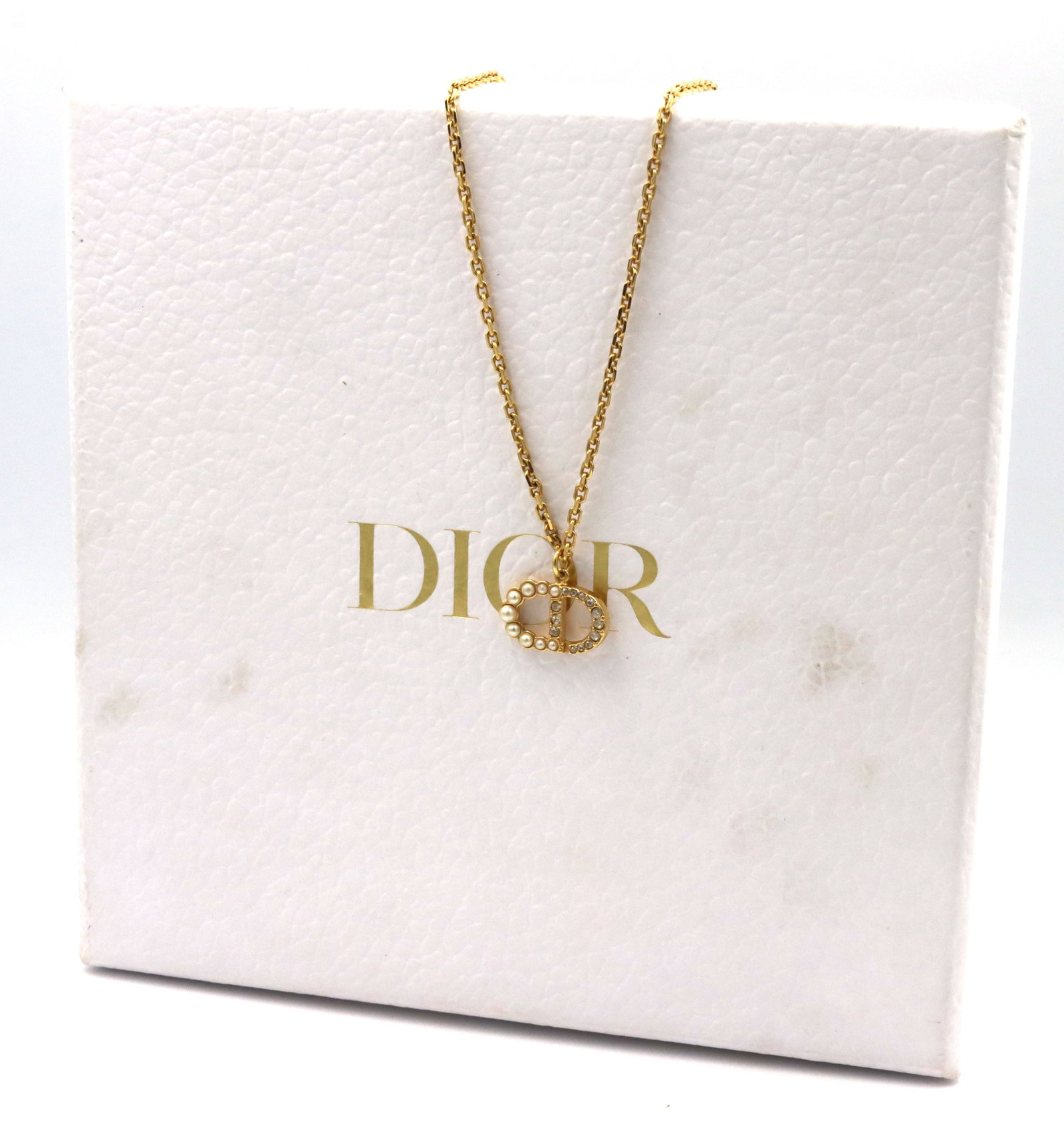Dior petit CD Duo pendant on chain: Dior petit CD Duo pendant on adjustable chain. 6.60 grams. Comes with Dior box.
