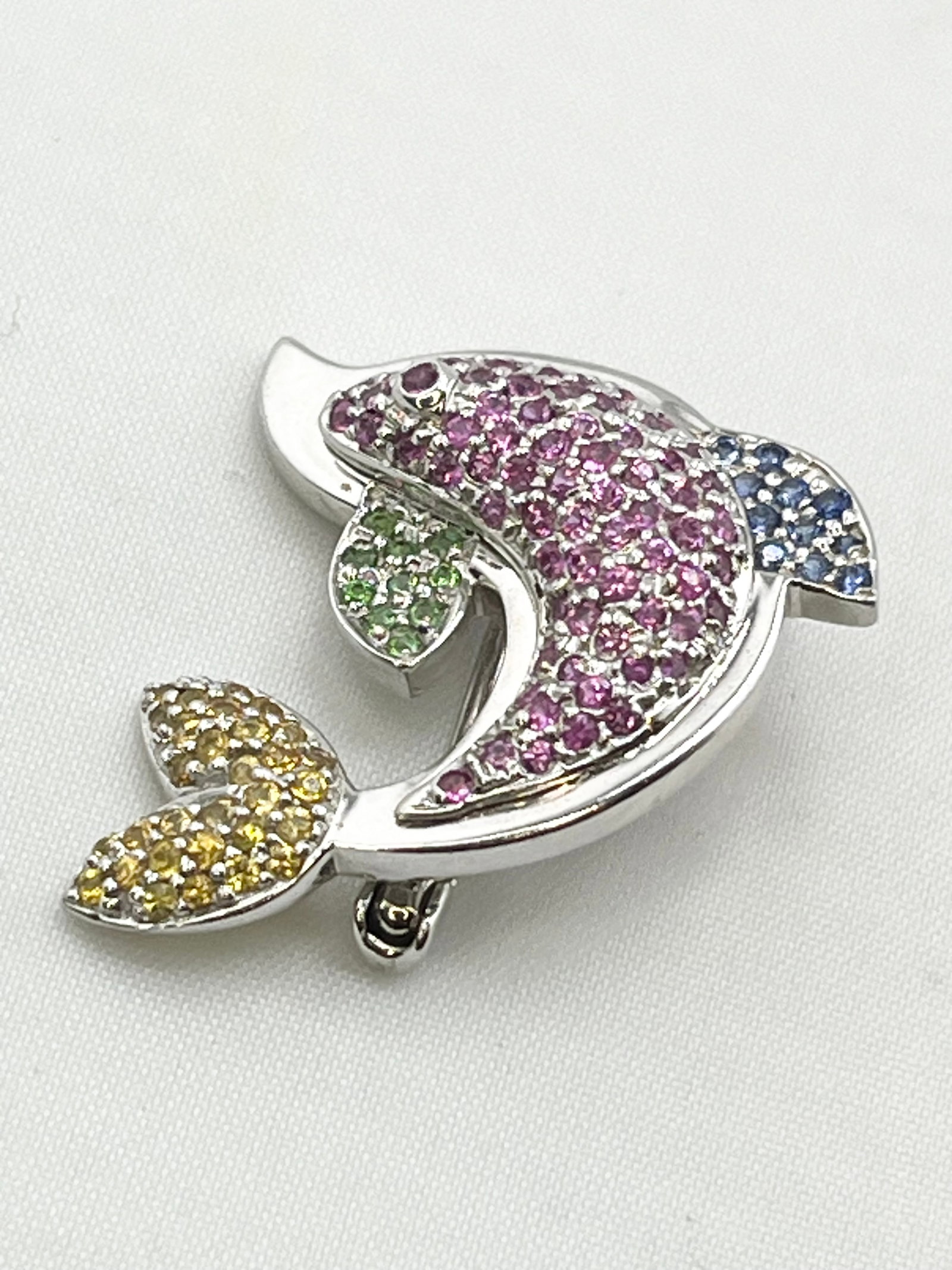 18KT White Gold Le Vian Multi Color Gem Stone Dolphin Brooch: 18KT White Gold Solid Le Vian Ruby, Blue, Green and Yellow Sapphire Dolphin Brooch. 7 grams